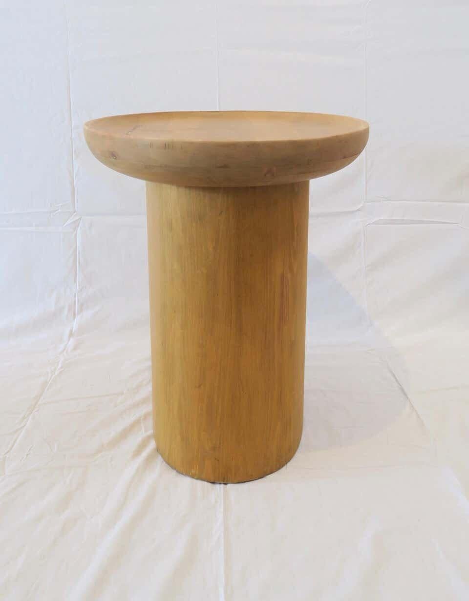 Martin & Brockett oval findley side table in waxed natural pine has a carved curved lip edge on tabletop on an oval pedestal base.

Each piece is individually crafted, slight variations in color, finish and grain may occur.
Lead time 10-12 weeks. As