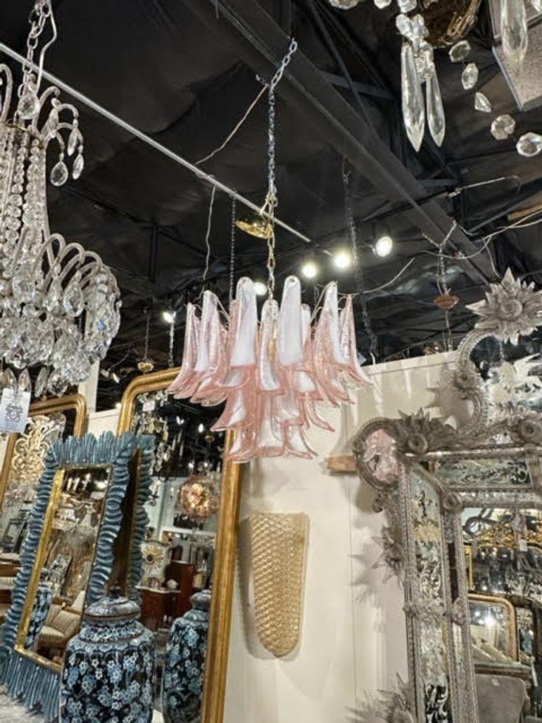 Very fine modern pink and white Murano glass saddle chandelier. Beautiful scale and shape and the glass is gorgeous. Creates a very stylish look!!