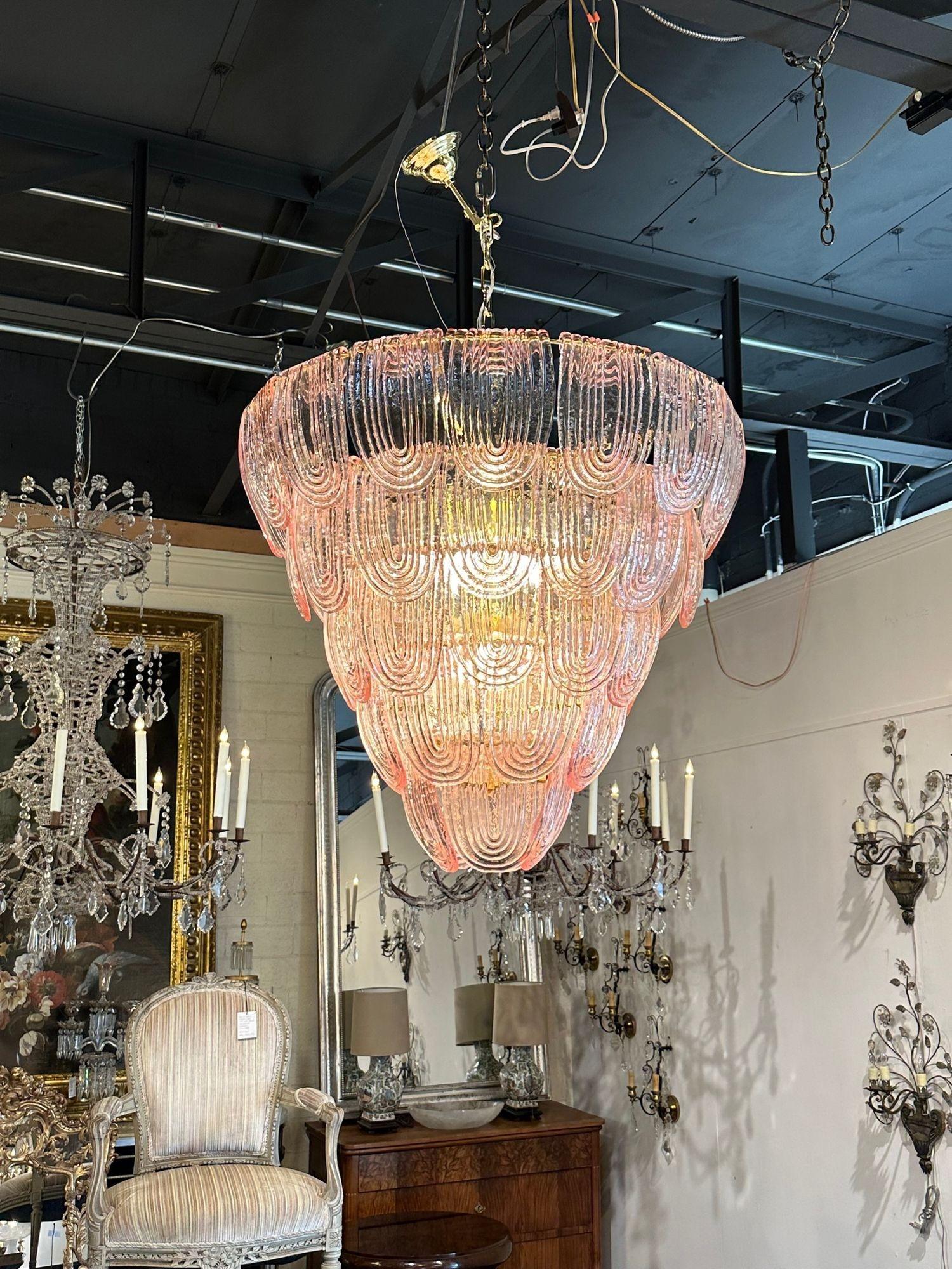Gorgeous modern pink Murano glass waterfall chandelier. Beautiful shimmering glass in such a pretty shade of pale pink. Creates a very impressive statement!.