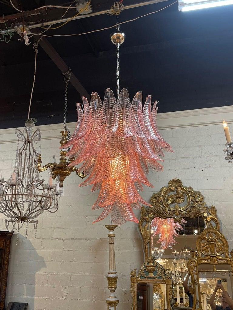 Beautiful modern pink Murano chandelier. Lovely layers of palm leaf shaped glass. This glistening beauty is a super stylish fixture and creates a real impact! Superb!
