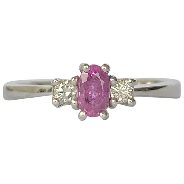 Modern Pink Sapphire and Diamond Platinum Three-Stone Ring For Sale