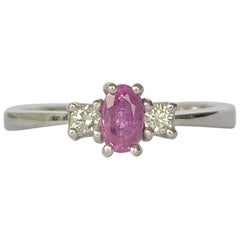 Retro Modern Pink Sapphire and Diamond Platinum Three-Stone Ring