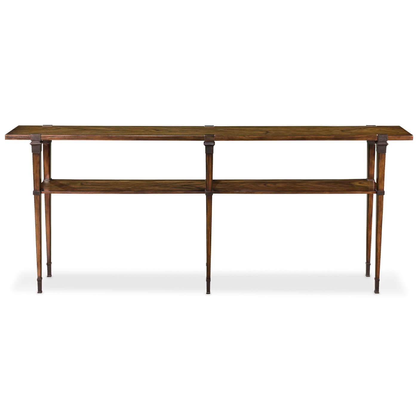 A modern plank top console table in a warm walnut finish. This long and narrow console has a beautiful wood plank top and one shelf suspended with bronze brackets. It sits on slender legs with cast bronze feet. 

Dimensions: 80