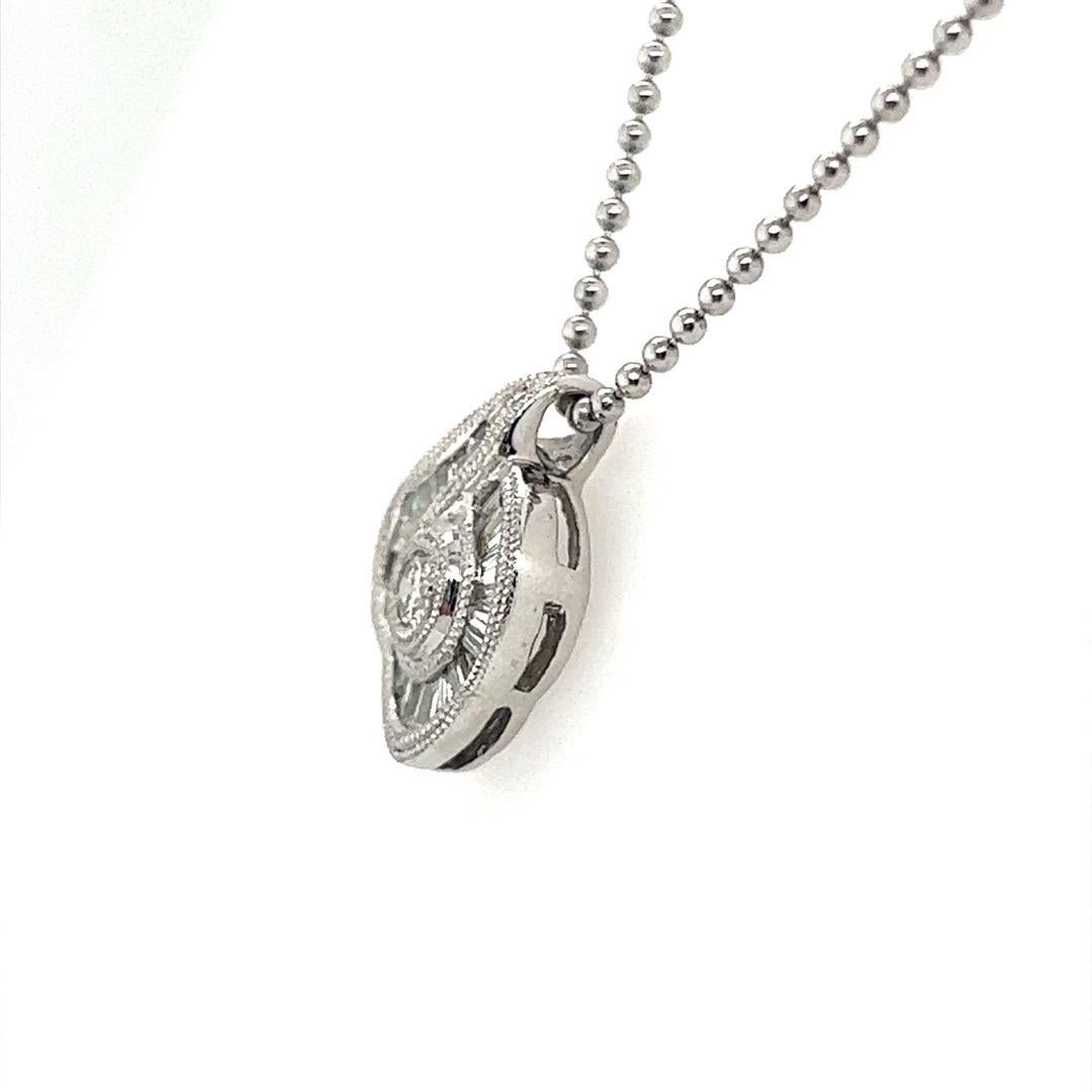 Stunning Platinum and Diamond Pendant. The chain is platinum as well. 

The piece is set with 24 natural near colorless baguette diamonds and one round brilliant.

Total weight is 7.5 grams.