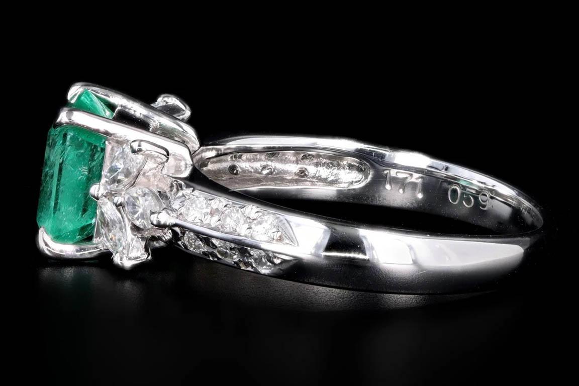 Modern platinum 1.71 carat natural emerald & diamond ring

Era: Modern
Composition: Platinum
Primary Stone: Square Emerald Cut Natural Emerald 
Carat Weight: Approximately 1.71 Carats
Accent Stone: Marquise & Round Brilliant Cut Diamonds
Carat