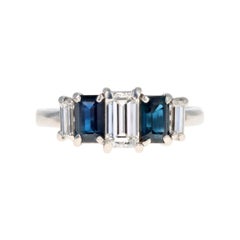 Modern Platinum .70 CTR Emerald Cut Diamond and Sapphire Ring