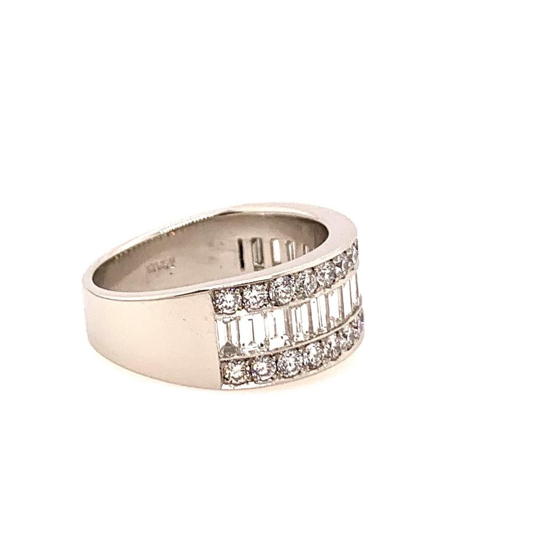 Modern Platinum 3 Carat Natural Diamond Band.

Set in this piece are 17 Natural F-G color Baguette Diamonds weighing 1.75 carats and measuring 3.5x2mm. In addition, there are 30 Natural Round Brilliant Diamonds weighing 1.25 carats.

The ring size