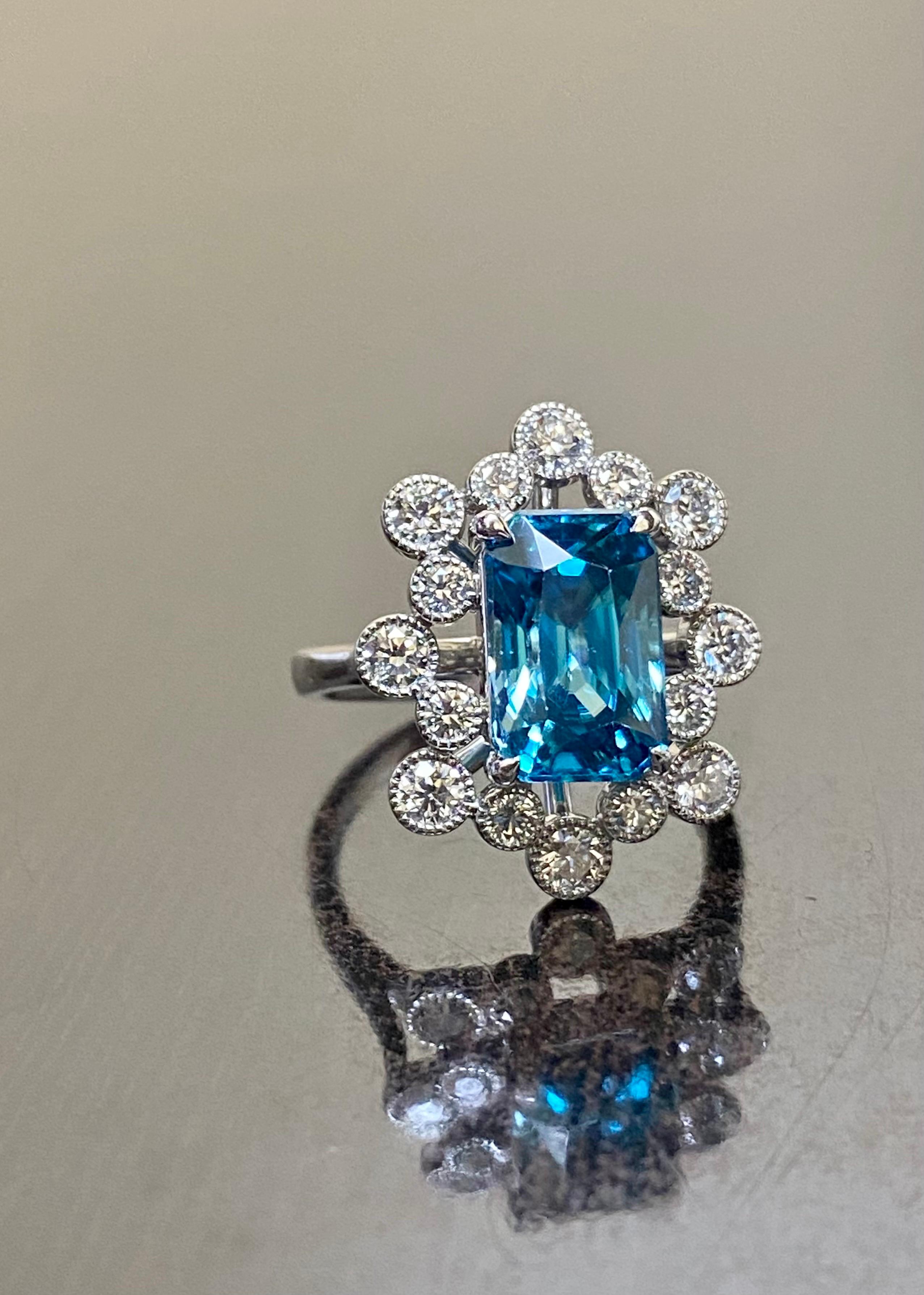 DeKara Designs Collection

Art Deco Inspired Extremely Elegant Entirely Handmade in Platinum Diamond Blue Zircon Engagement Ring.

Metal- 90% Platinum, 10% Iridium.

Stones- 1 Rectangular Radiant Cut Blue Zircon 6.53 Carats, 18 Round Diamonds F-G