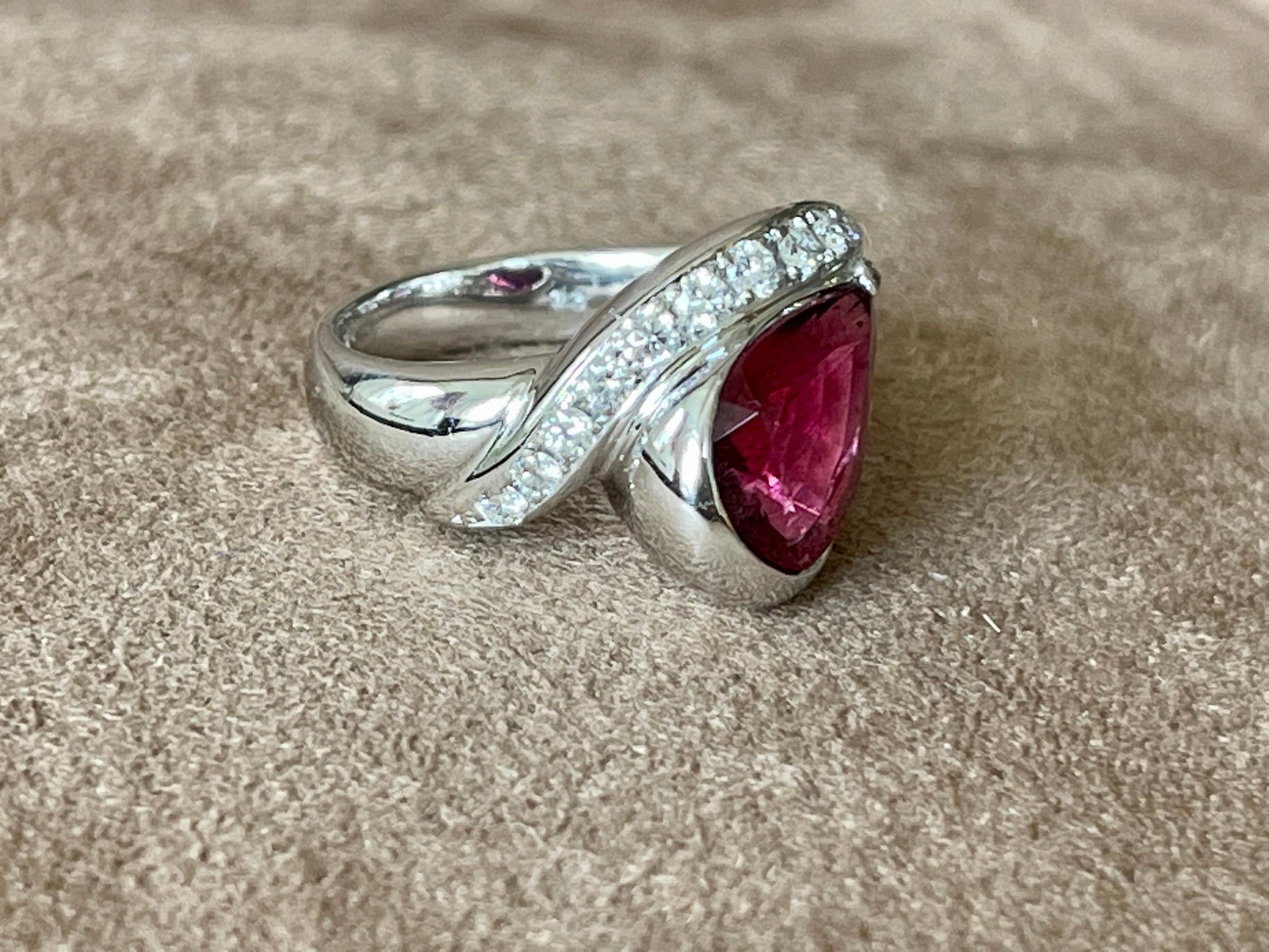 Modern Platinum Ring 900 featuring a lovely intense pear shape Rubelite weiging 3.01 ct and pavé set brilliant cut Diamonds weighing 0.45 ct. 
The ring size is currently a swiss 53/13 American Ring size 6 1/2, but can easily be resized. The ring is