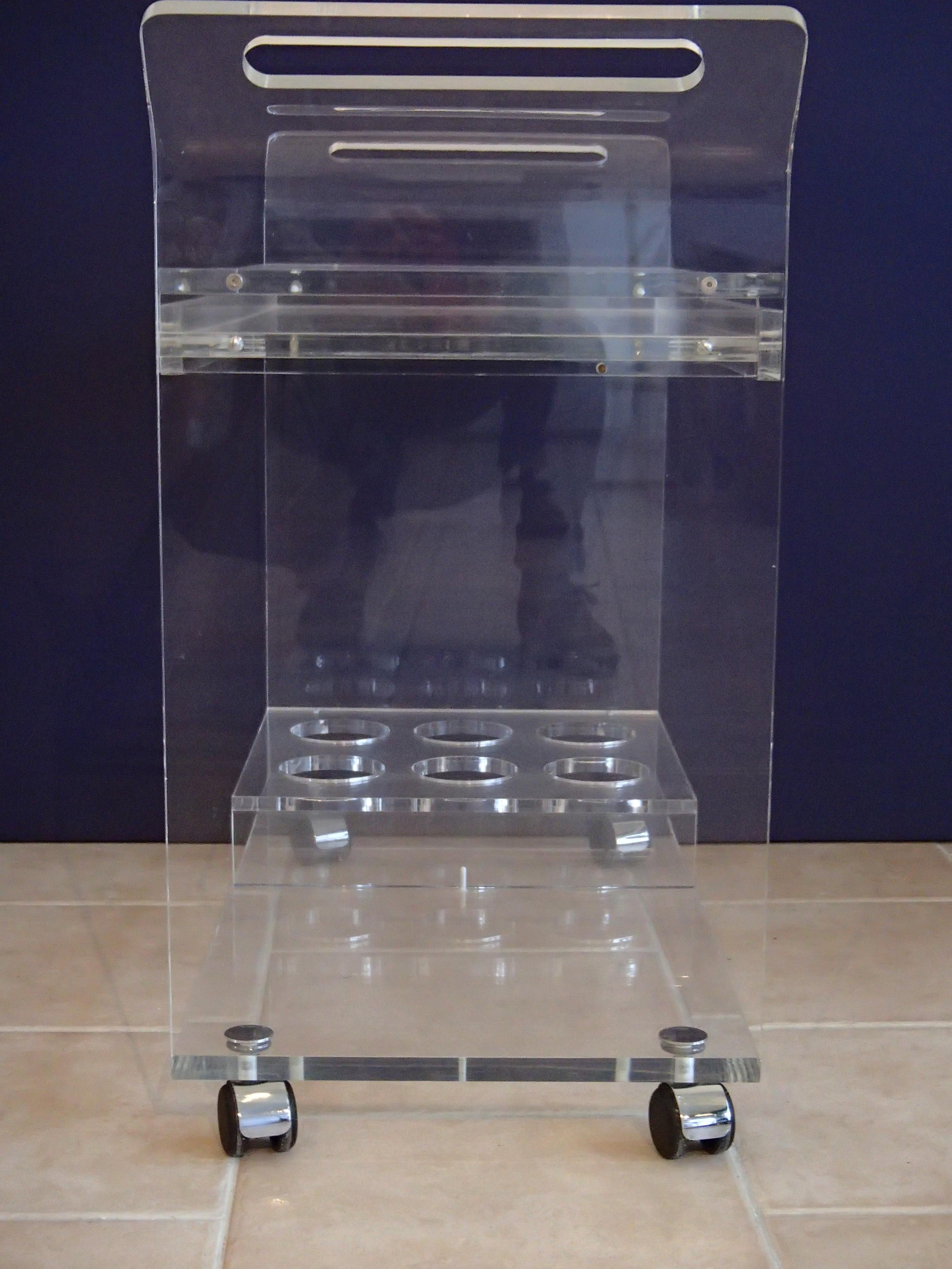 Modern plexiglas trolley with drawer.