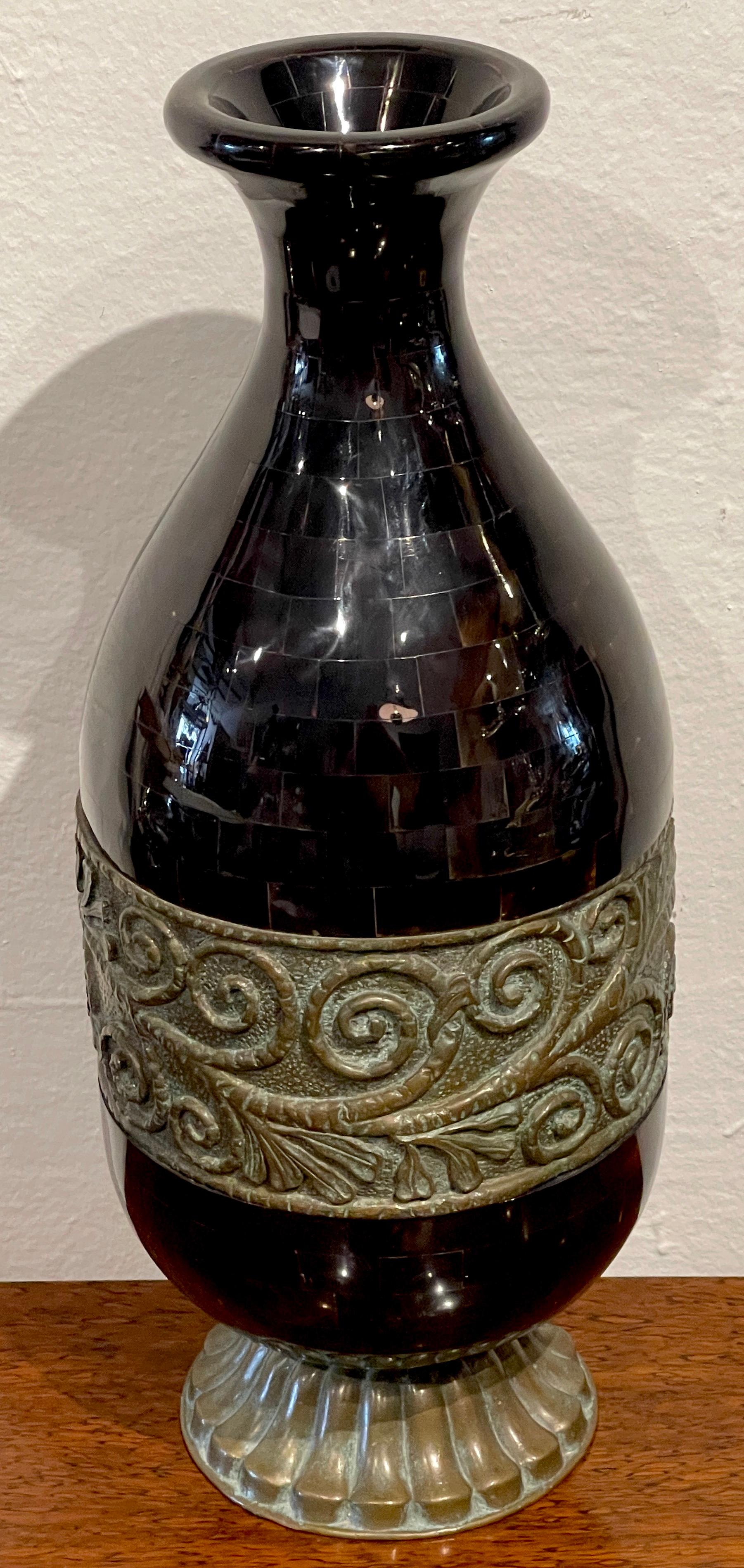 Modern polished horn & bronze vase by Maitland-Smith 
Circa 1980s

Of typical form, with continuous inlaid/mosaic rectangular polished horn pieces, undulating vase form, the vases shape descends, then widens with a finely cast bronze frieze of