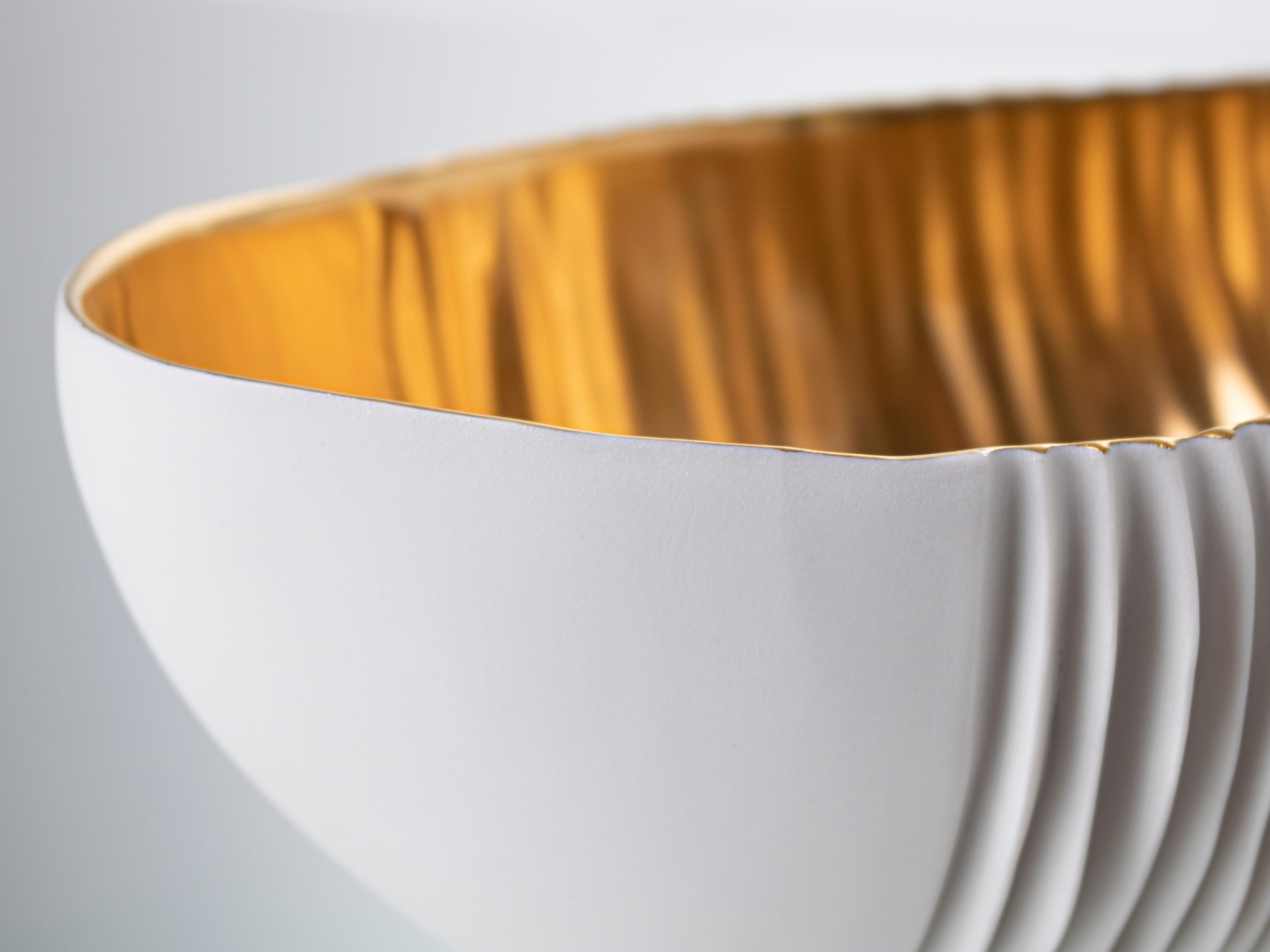 white and gold decorative bowl