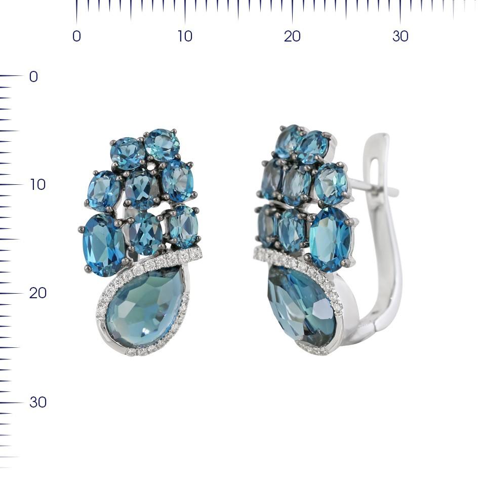 Earrings White Gold 14 K (Matching Ring Available)
Diamond 40-Round 57-0,16-4/6A
Topaz 2-Round-3,68 (1)/1A
Topaz 2-Oval-1,14 (1)/1A
Topaz 10-Oval-0,17 (1)/1A
Topaz 4-Round-0,68 (1)/1A
Weight 6 grams

With a heritage of ancient fine Swiss jewelry