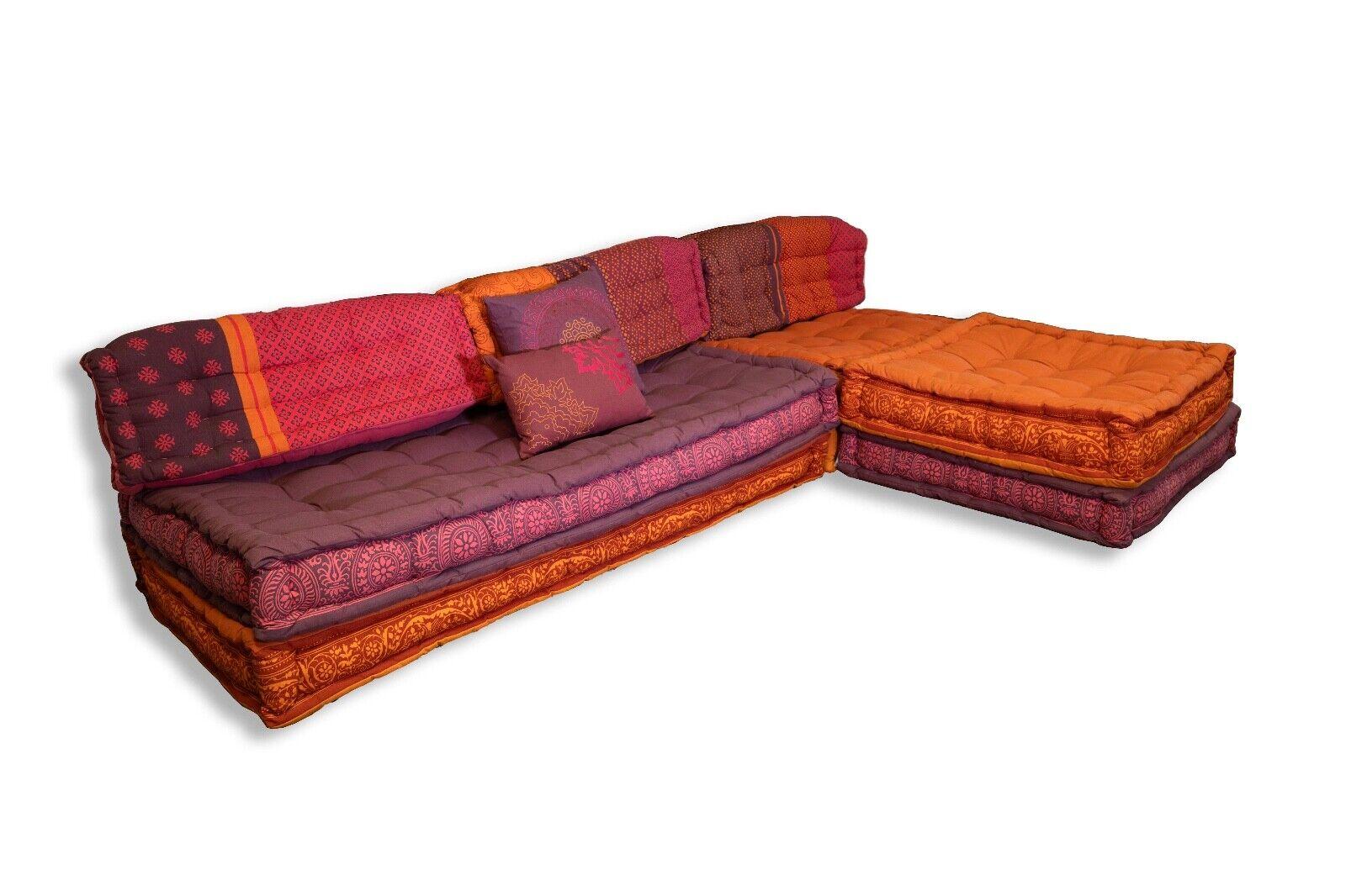 The Modern Purple & Orange Sofa Sectional draws inspiration from the iconic Roche Bobois Mah Jong Modular Style, offering a fresh and contemporary twist on a classic design. This stunning sectional sofa combines vibrant purple and orange hues,