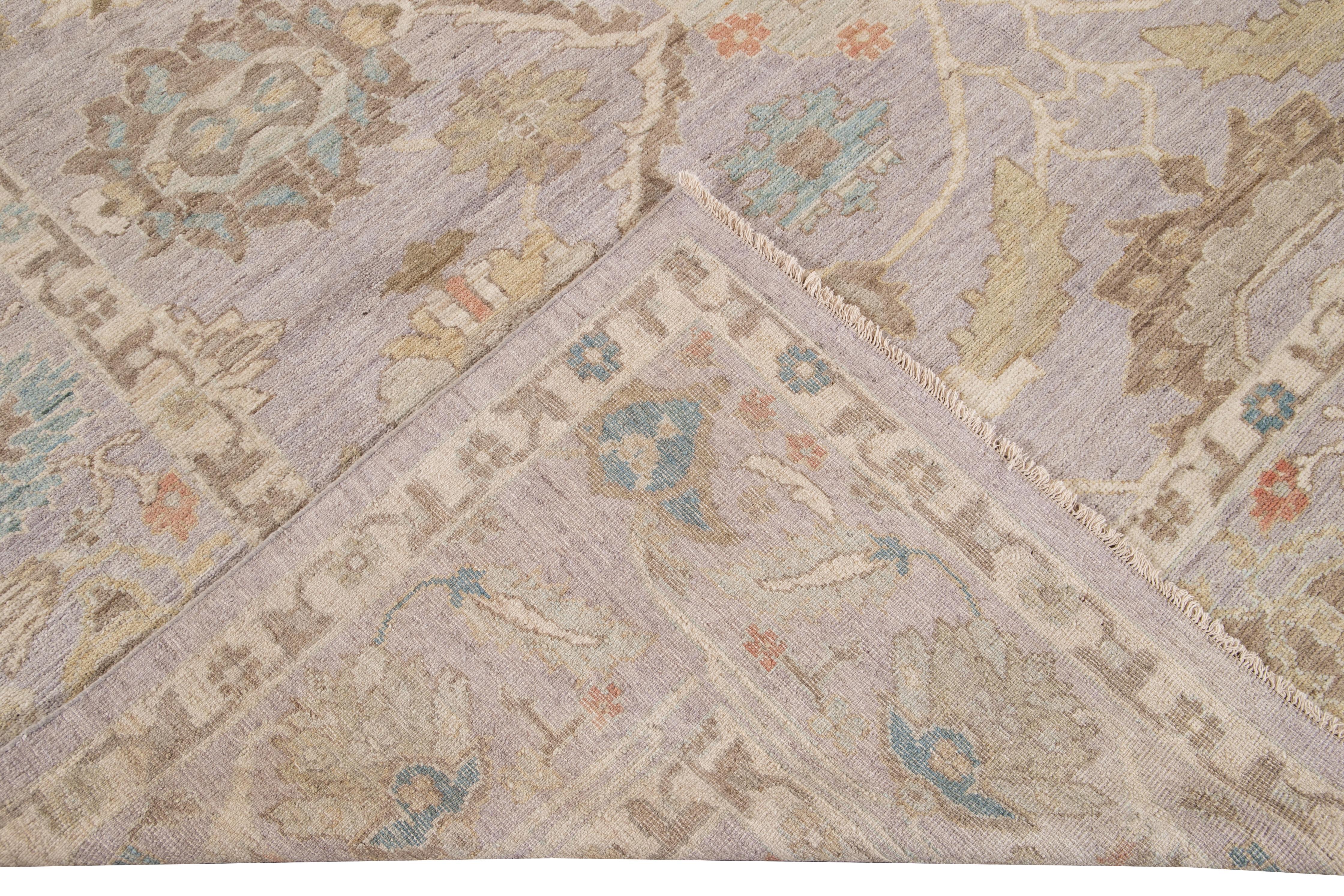 Beautiful modern Sultanabad hand knotted wool rug with a purple field. This Sultanabad rug has a multi-color accent in a gorgeous all-over Classic floral medallion design.

This rug measures: 10'3