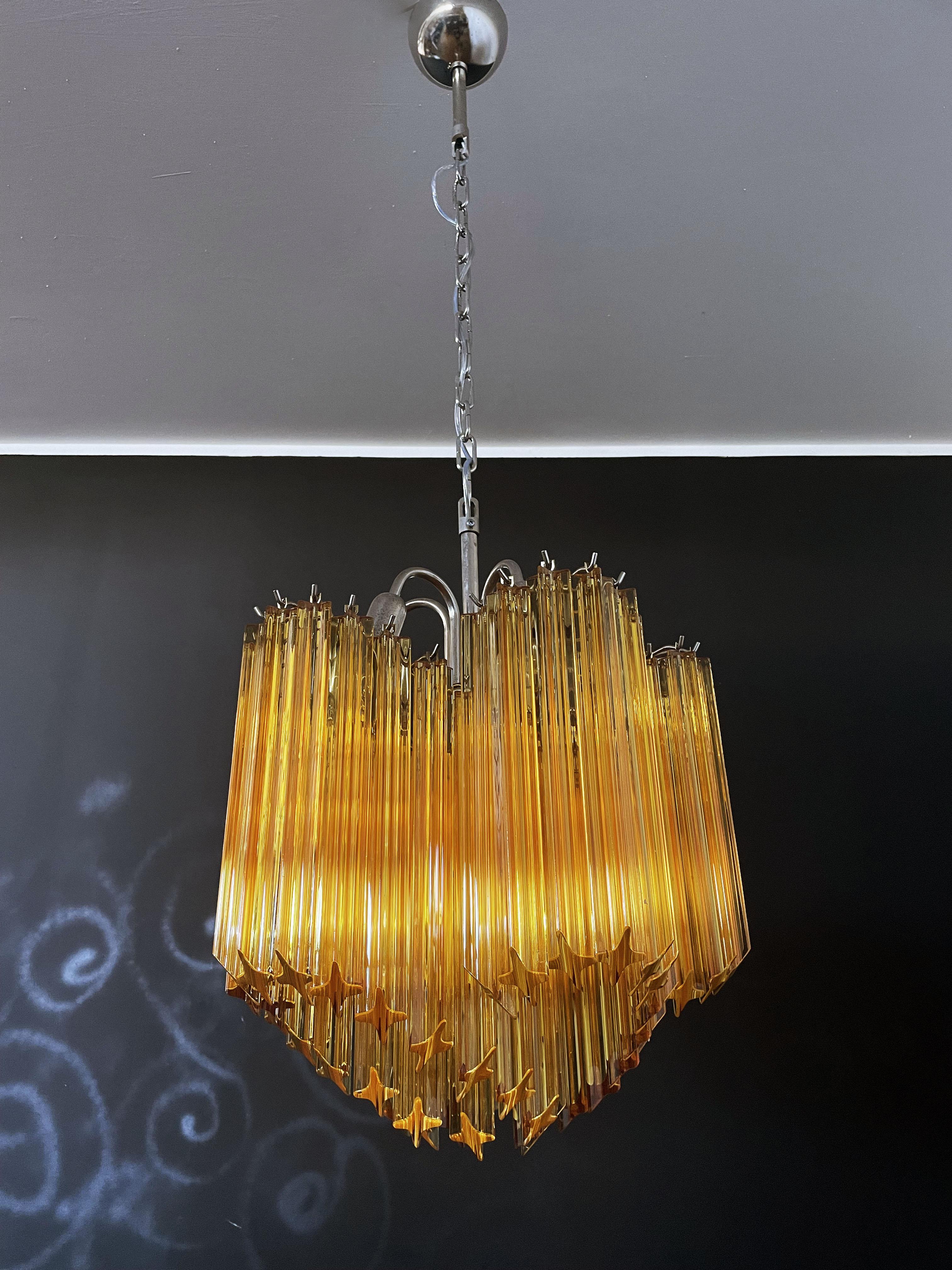 A magnificent Murano glass unique chandelier, spiral shape, very elegant, 60 amber quadriedri on nickel metal frame. This midcentury Italian chandelier is truly a timeless Classic.
Period: late 20th century
Dimensions: 46,50 inches (120 cm) height