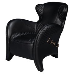 Poltrona moderna in pelle nera trapuntata