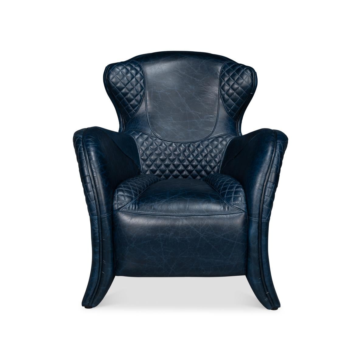With top grain Chateau Blue leather, with a sloping rear and curved arms, with a partially quilted seat and backrest, with decorative buckles.
Dimensions: 31