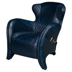 Poltrona moderna in pelle blu trapuntata