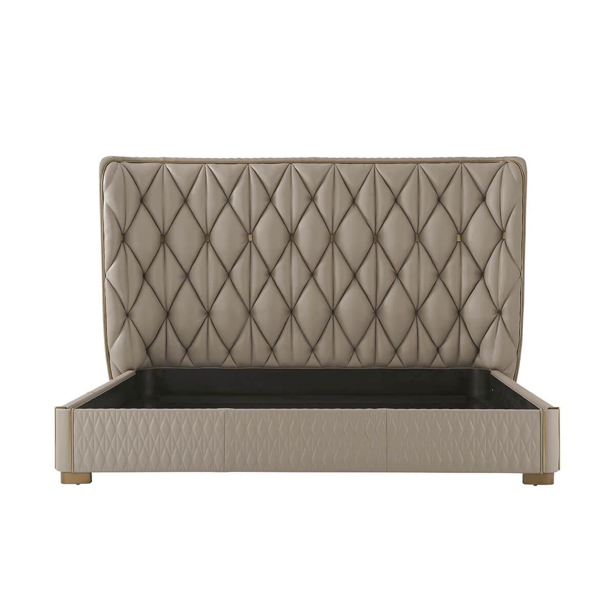 Modern Quilted King Bed with an upholstered curved headboard. With geometric quilting and tufting and brass button details.

With a bronze finish molding surround and quilted rails raised on recessed feet. Shown in Almond-LE0401A Leather and