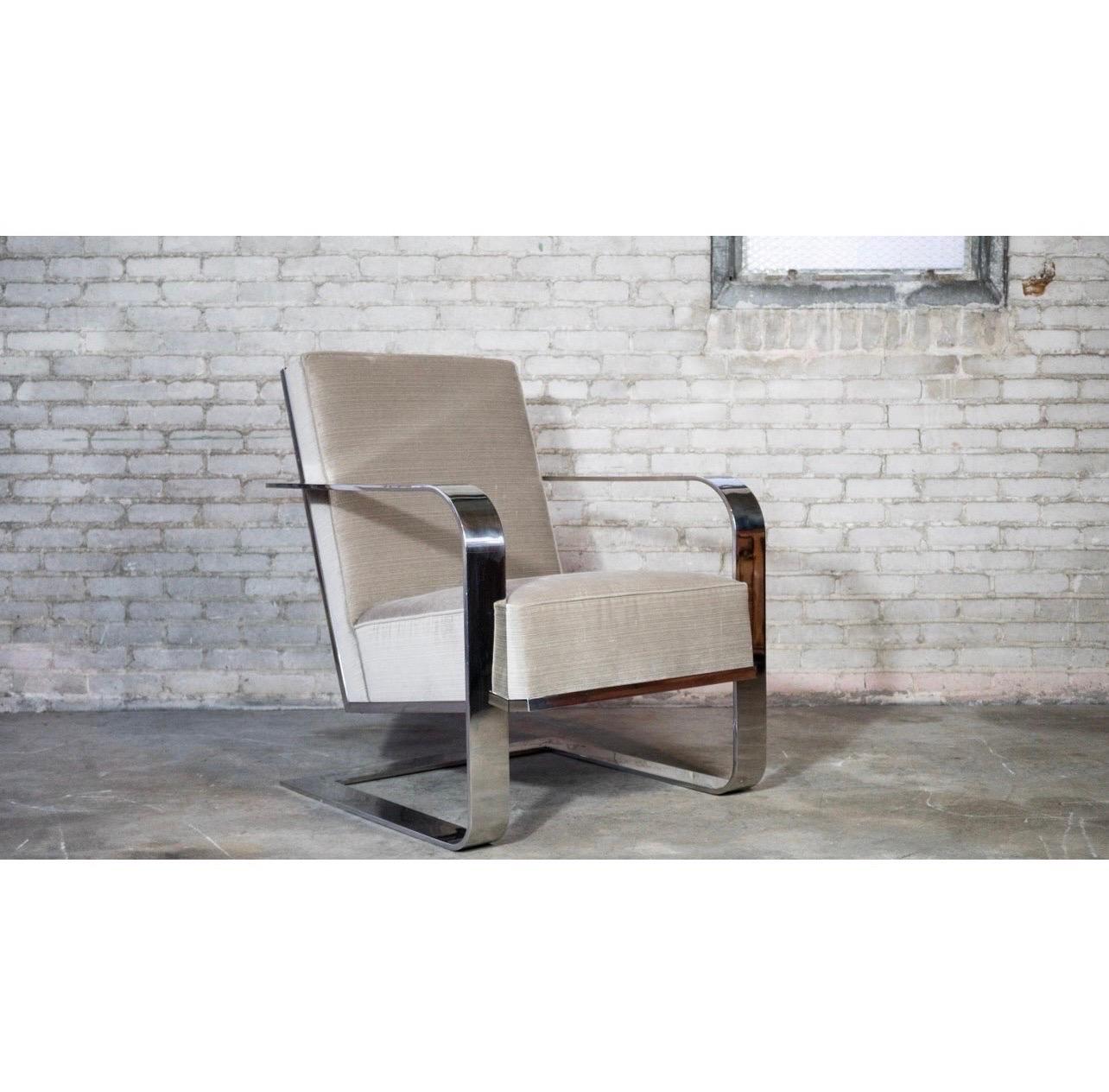 Sleek and sexy Ralph Lauren chrome lounge chair upholstered in a luxurious beige mohair fabric. Impressive large presence balanced with reflective attributes and the aforementioned neutral color. The coveted chrome flat bar frame features oversized