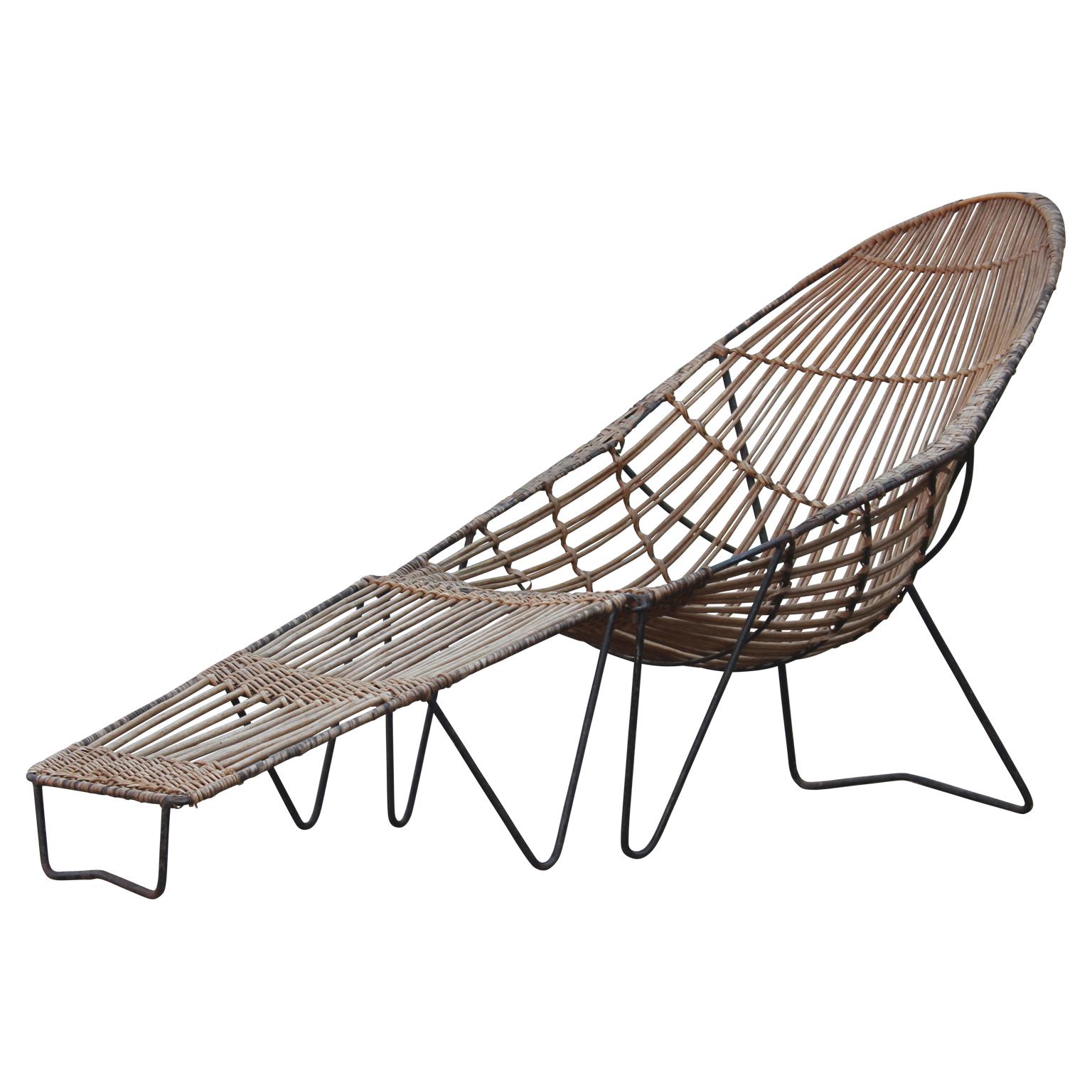 Modern rattan lounge chair with removable ottoman in the style of Van Keppel-Green or Ico Parisi.

Depth of chair without the ottoman: 39 in. D.