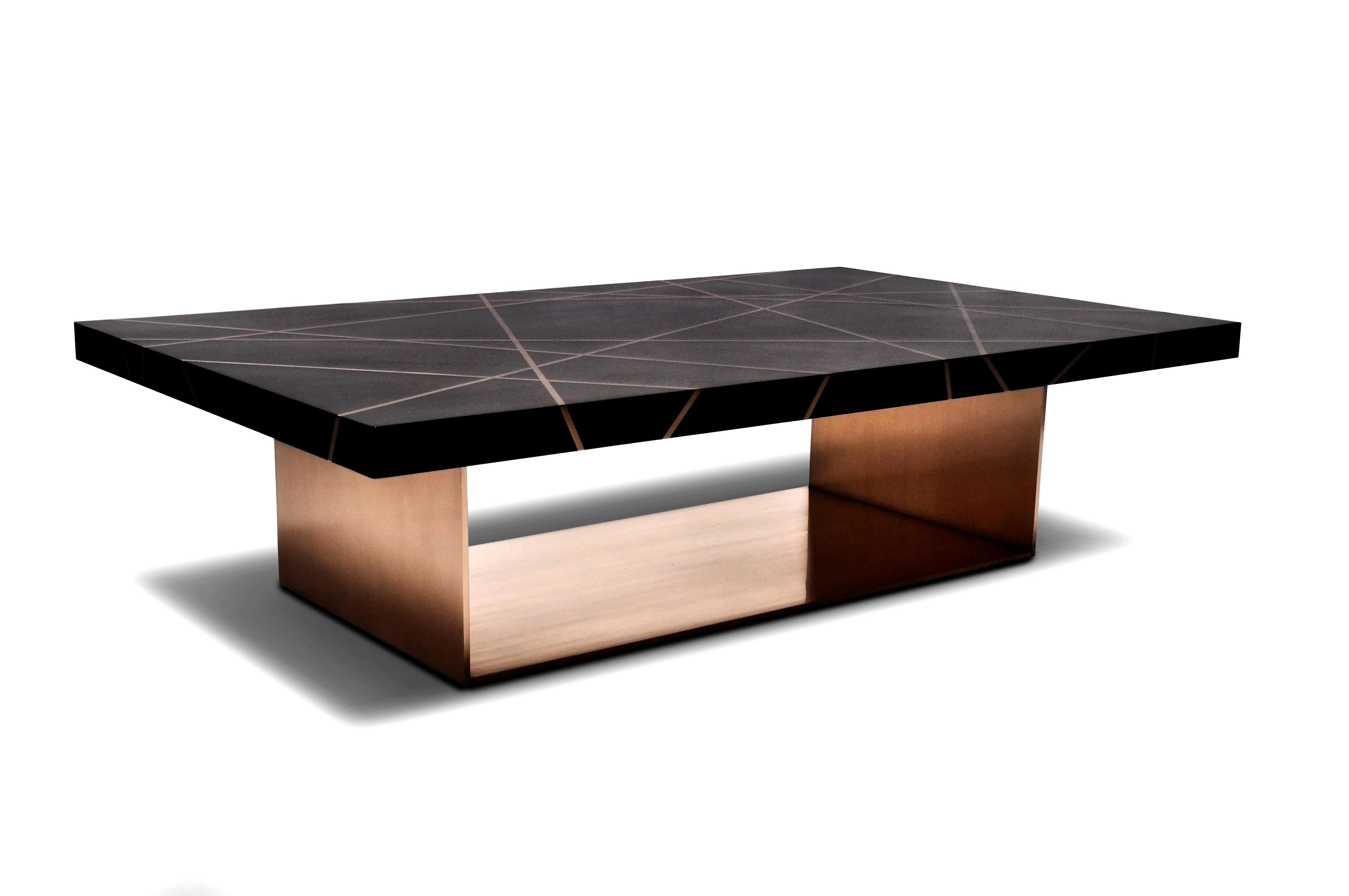 This Ray rectangular cocktail table is designed using custom dyed figured walnut with bronze inlay in a ray pattern with a solid bronze base. The figured walnut top is a custom finish in a flat polished sheen with a custom radius edge detail. The