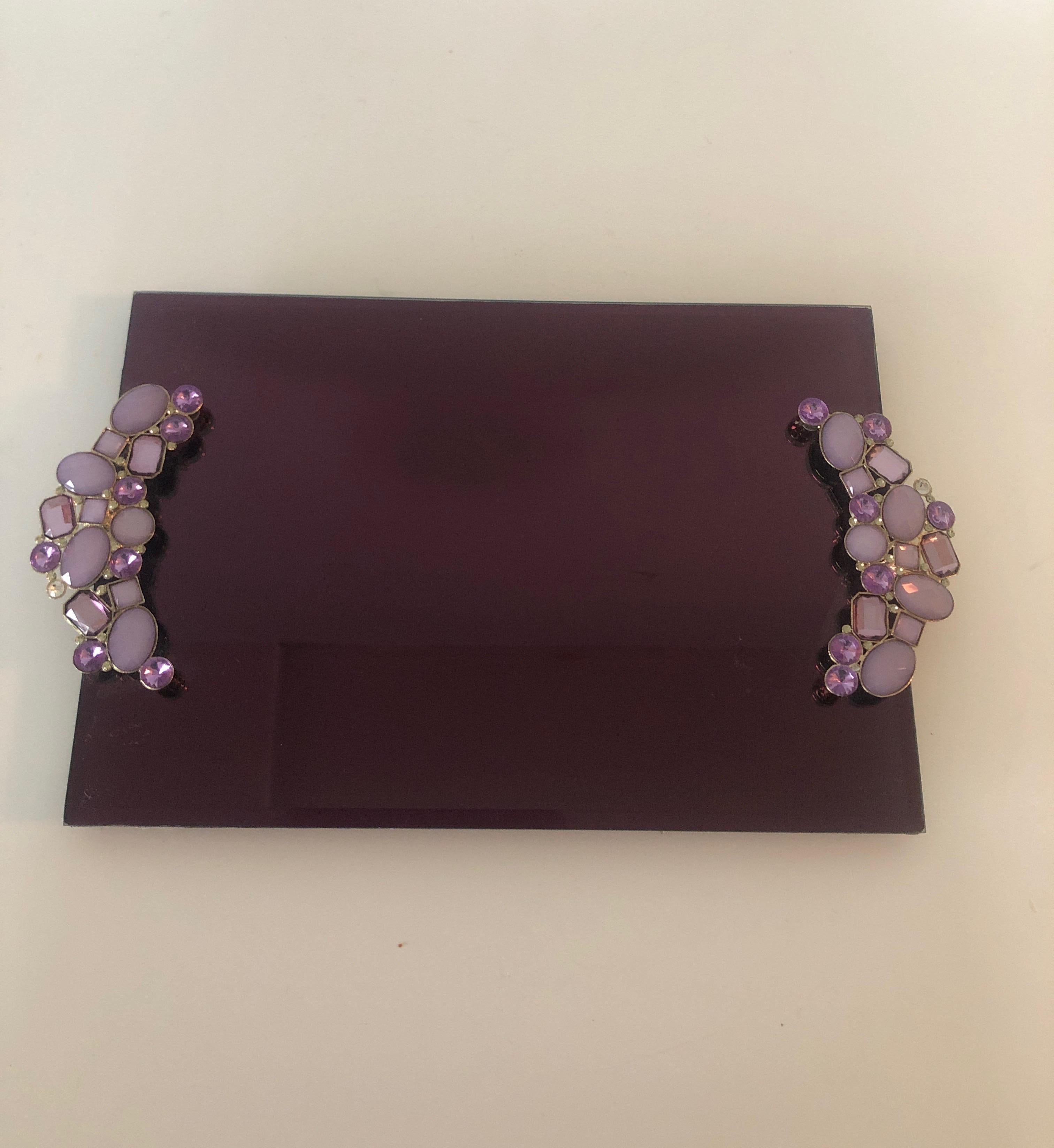 Modern Rectangular Amethyst color glass vanity tray.
Bejeweled handles and beveled edges.
Size: 9
