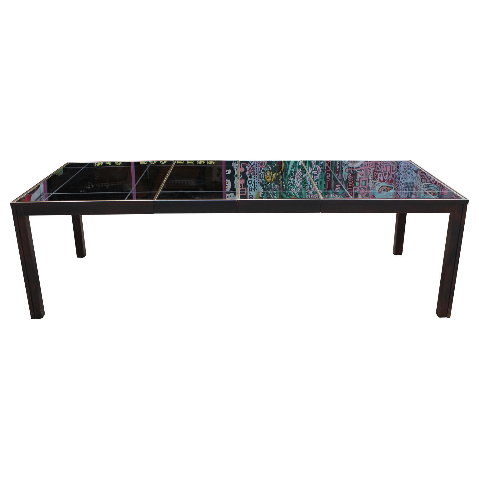 Gorgeous and sleek rectangular dining table with a unique smoked mirror top and a lovely brass inlay.
