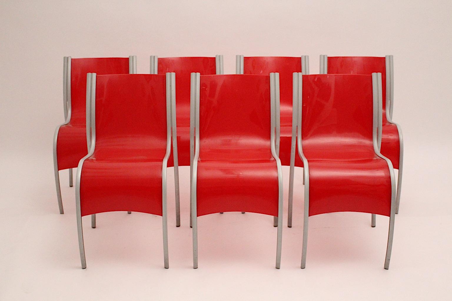 Modern set of 7 red plastic vintage chairs or dining chairs from red plastic and aluminum FPE Fantastic Plastic Elastic by Ron Arad for Kartell Italy 1999.
An amazing set of seven ( 7 ) red curved plastic seat shell chairs with aluminum frame which
