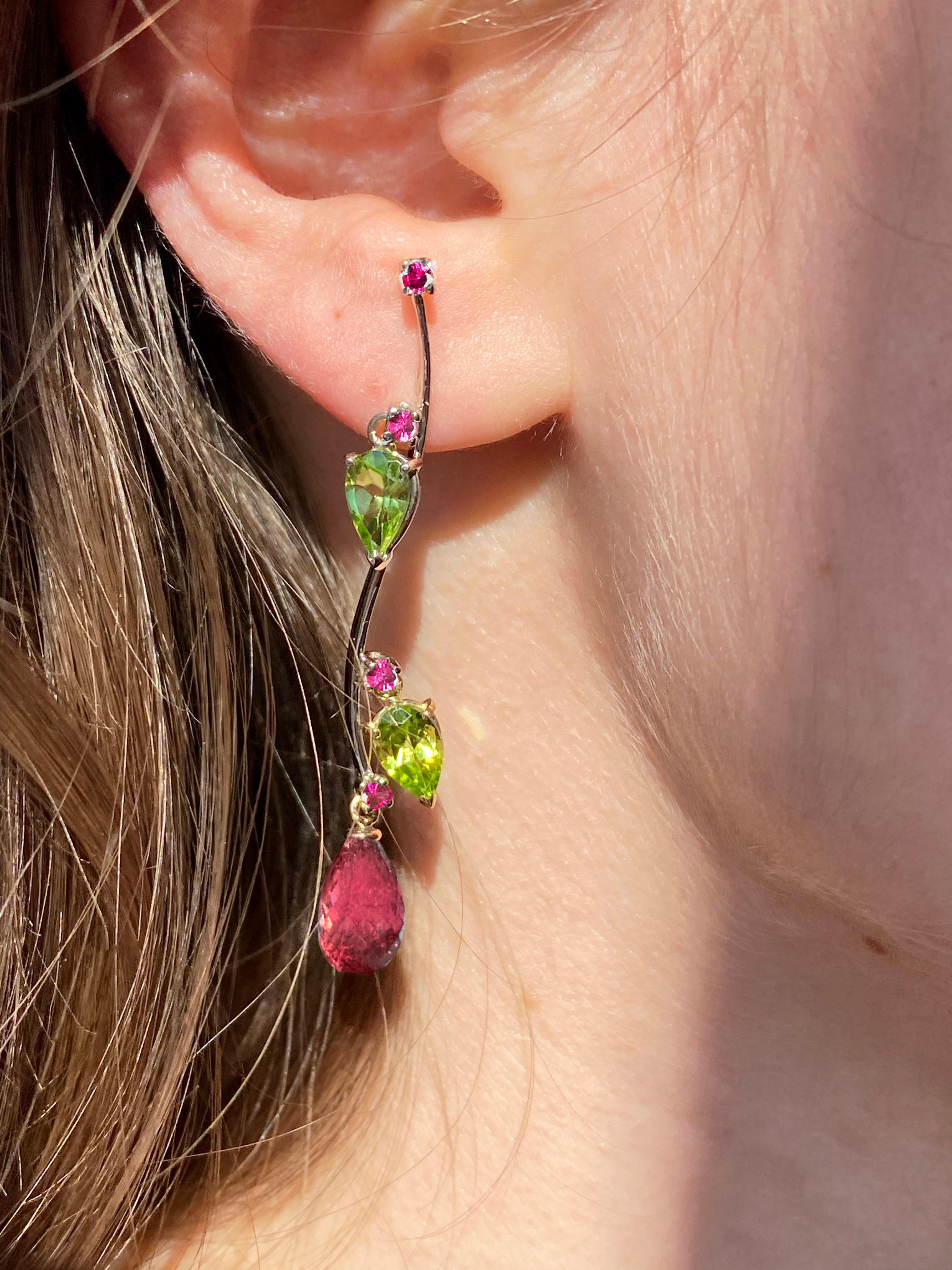 Rossella Ugolini Design Collection, these 18k Yellow Gold Earrings are a true masterpiece handcrafted in Italy by skilled artisans with precious gemstones like red Rubelite Tourmaline, and Peridot. They Unique Design takes inspiration from the