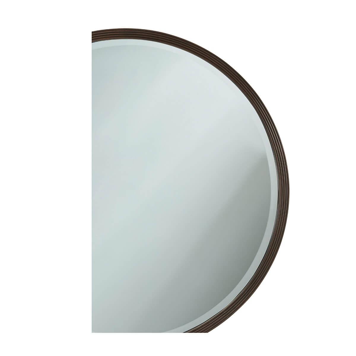  A modern mirror with a reeded frame in our dark Bistre finish with a beveled glass mirror plate.
Dimensions: 36