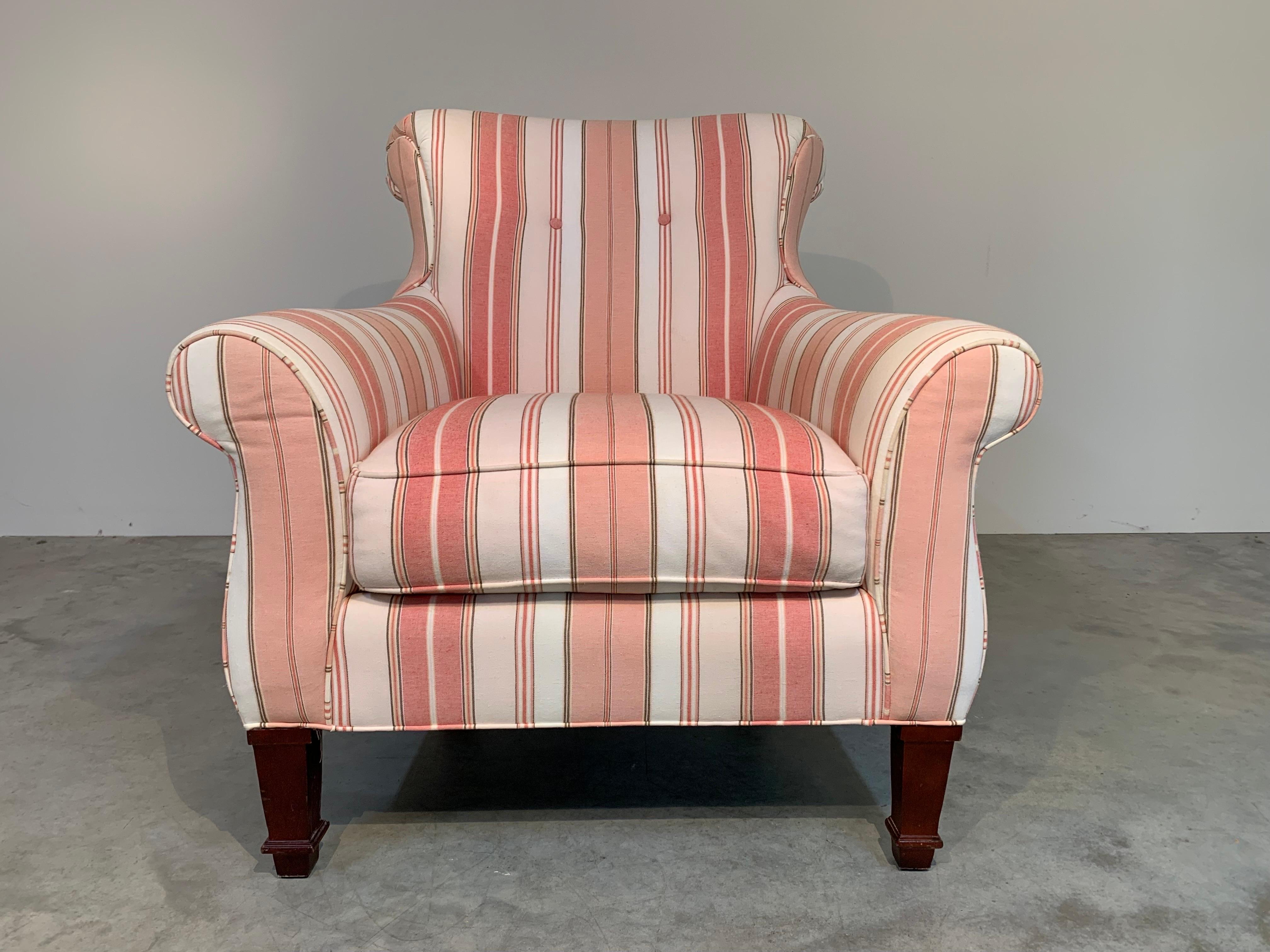 Modern regency style scroll arm & back lounge or club chair in salmon & white stripe cotton linen upholstery over Directoire style walnut legs by CR Laine in the manner of Henredon or Baker. 
 Wonderfully comfortable lounge chair having buoyant