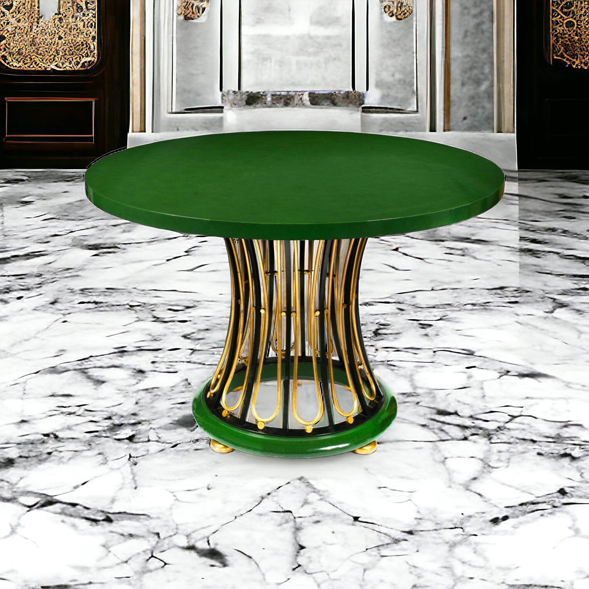 This is a show stopper! This is a modern interpretation of a regency table. The top is a green lacquered wood resting upon a woven gilt metal base and gilded bun feet. It is by Baker Furniture Company. 

