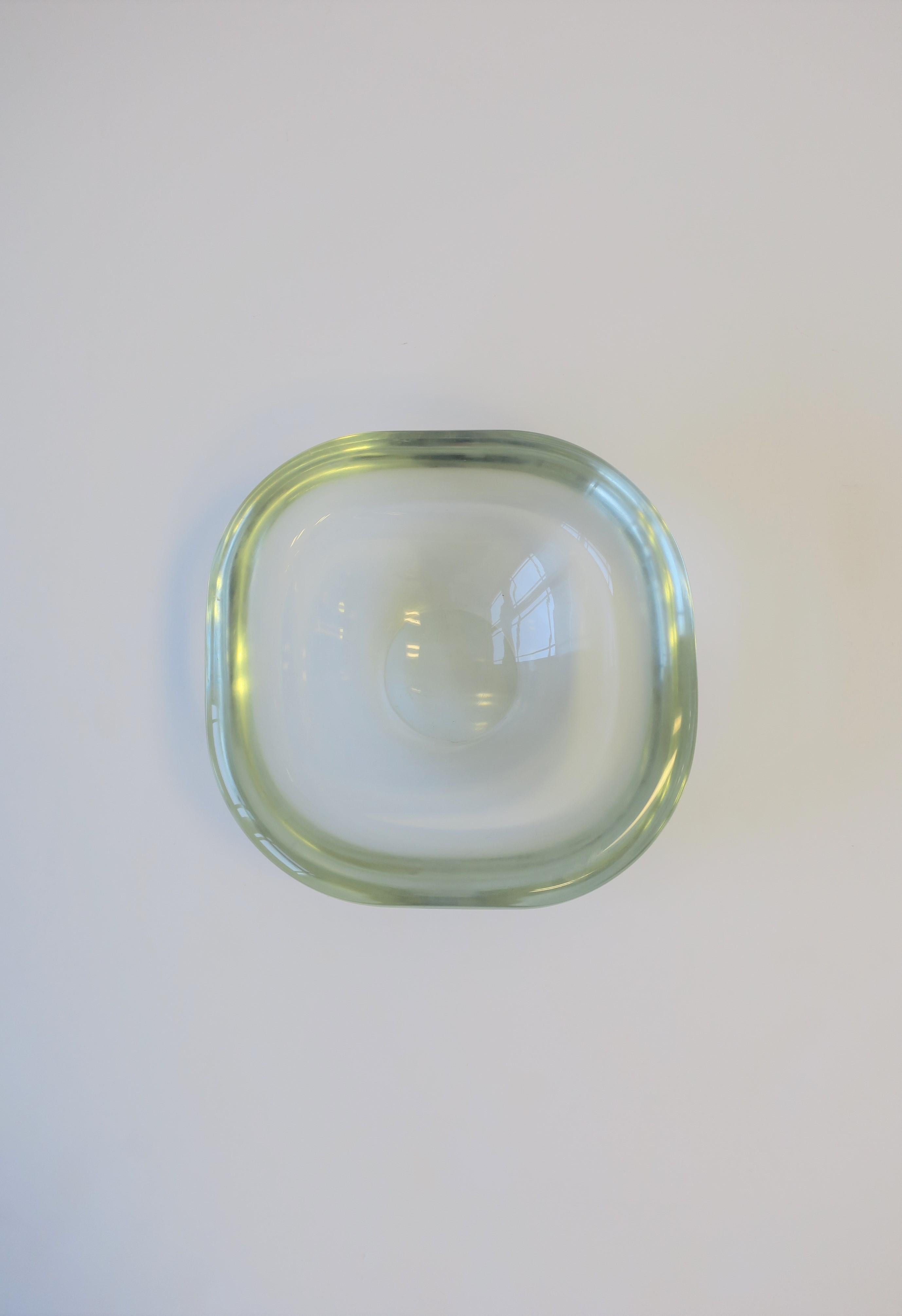 A very beautiful, substantial, signed Modern Italian Murano art glass bowl by designer Renato Anatra, circa mid-late 20th century, Italy. Bowl is clear/very light-green 'glass' hue with a smooth exterior and round edge. Measures 1.5