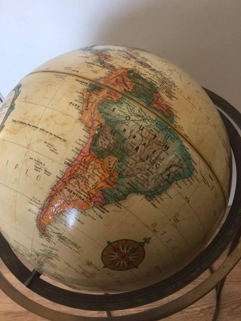 Midcentury globe attributed to Paul McCobb in modern design brass stand.