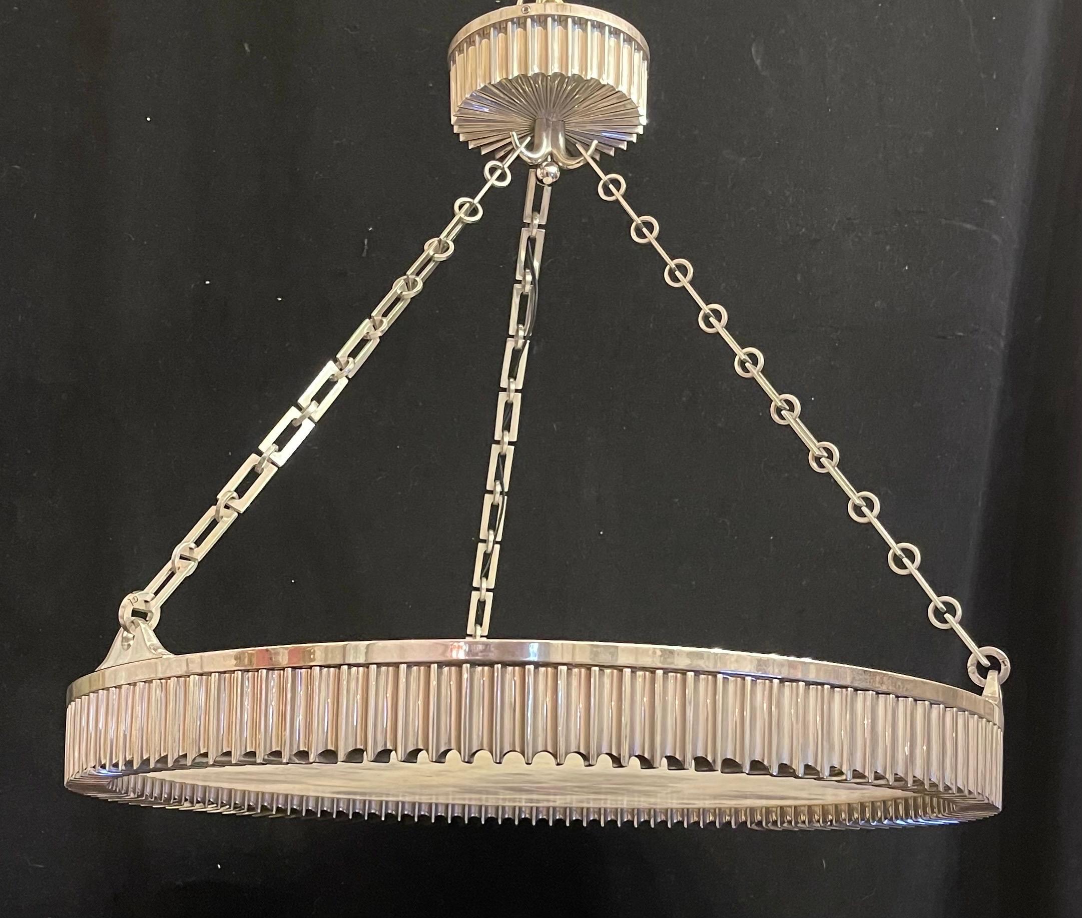 A Wonderful Modern Ribbed Polished Nickel over bronze with rock / quartz crystal center this beautiful round chandelier Measures 24