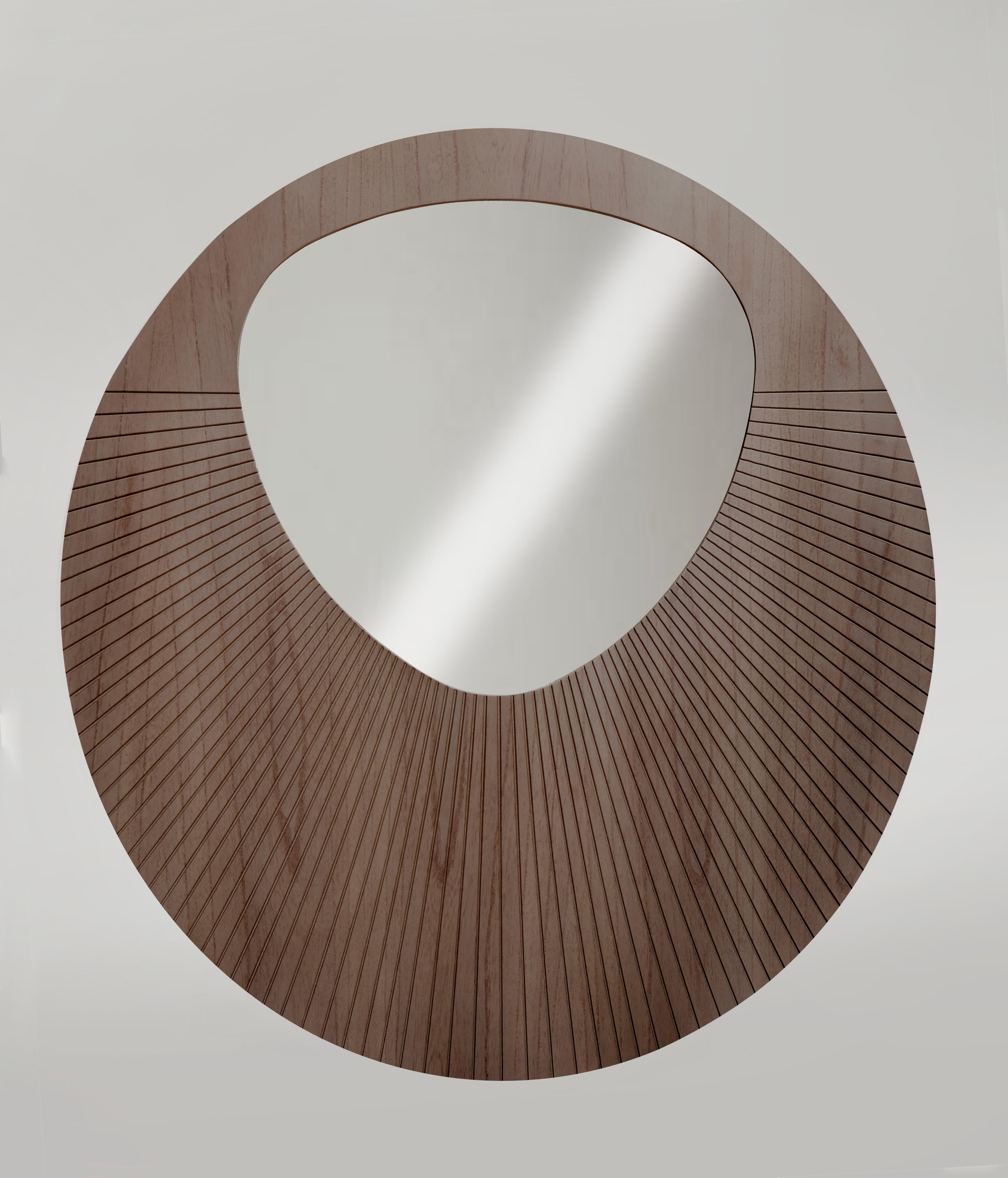 A modern reinterpretation of ornamental wall mirrors for the contemporary home, The Rilla’s organic mirror shape snaps biomimicry inspiration from leafs, rocks and plants, which gives it an air of renewal to be displayed in an arrangement, or by its