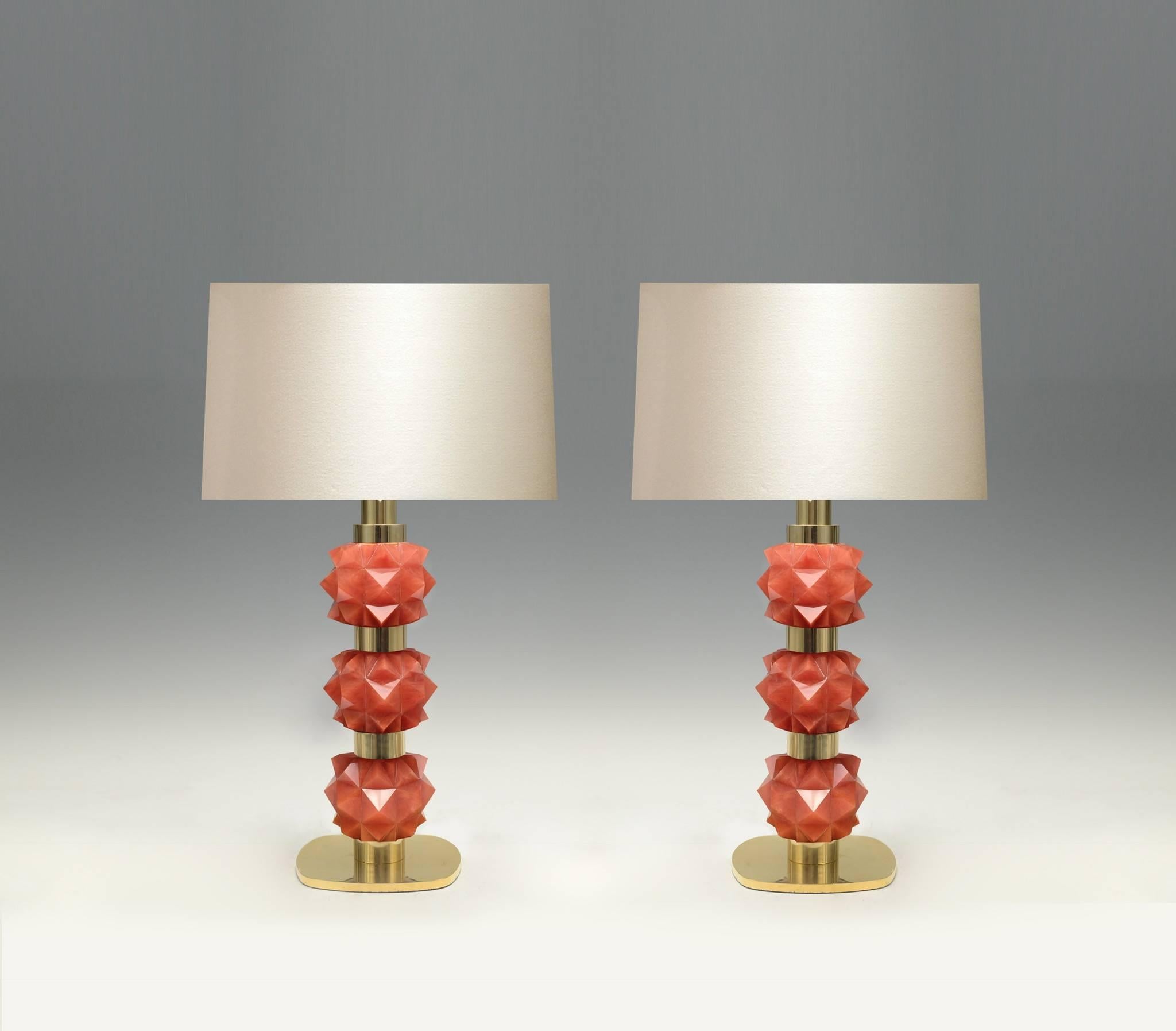 A pair of fine carved rock candy form coral rock crystal quartz lamps with polished brass decorations, created by Phoenix gallery.
Lampshade not included.

  