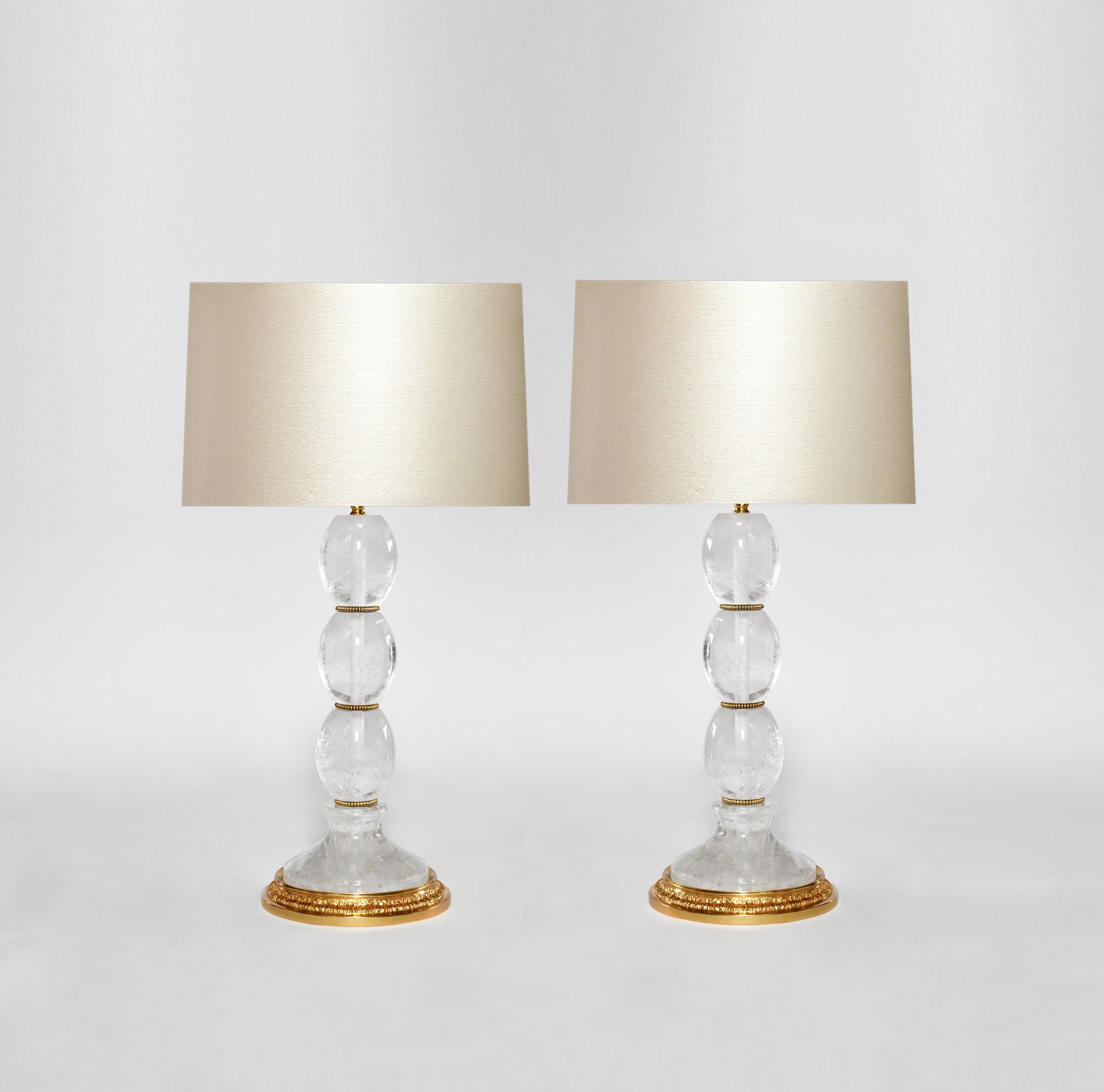 Pair of modern rock crystal lamps with polish brass decoration. Created by Phoenix Gallery, NYC.
To the top of the rock crystal is 15 in.
(Lampshade not included).
Custom size and metal finish upon request.