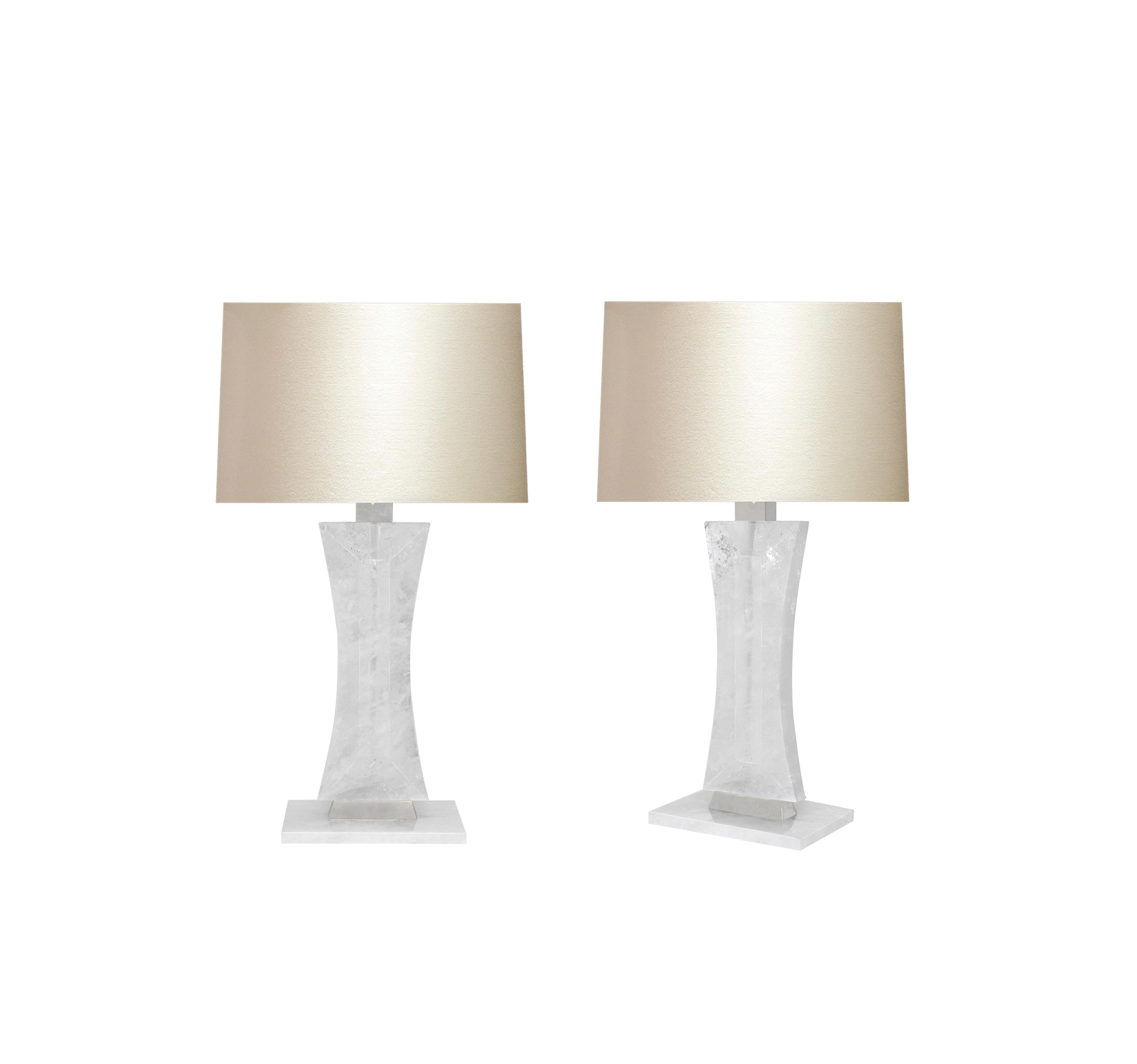 Pair of finely carved modern rock crystal quartz lamps with matte nickel decoration. Created by Phoenix Gallery, NYC.
To the rock crystal: 15.75