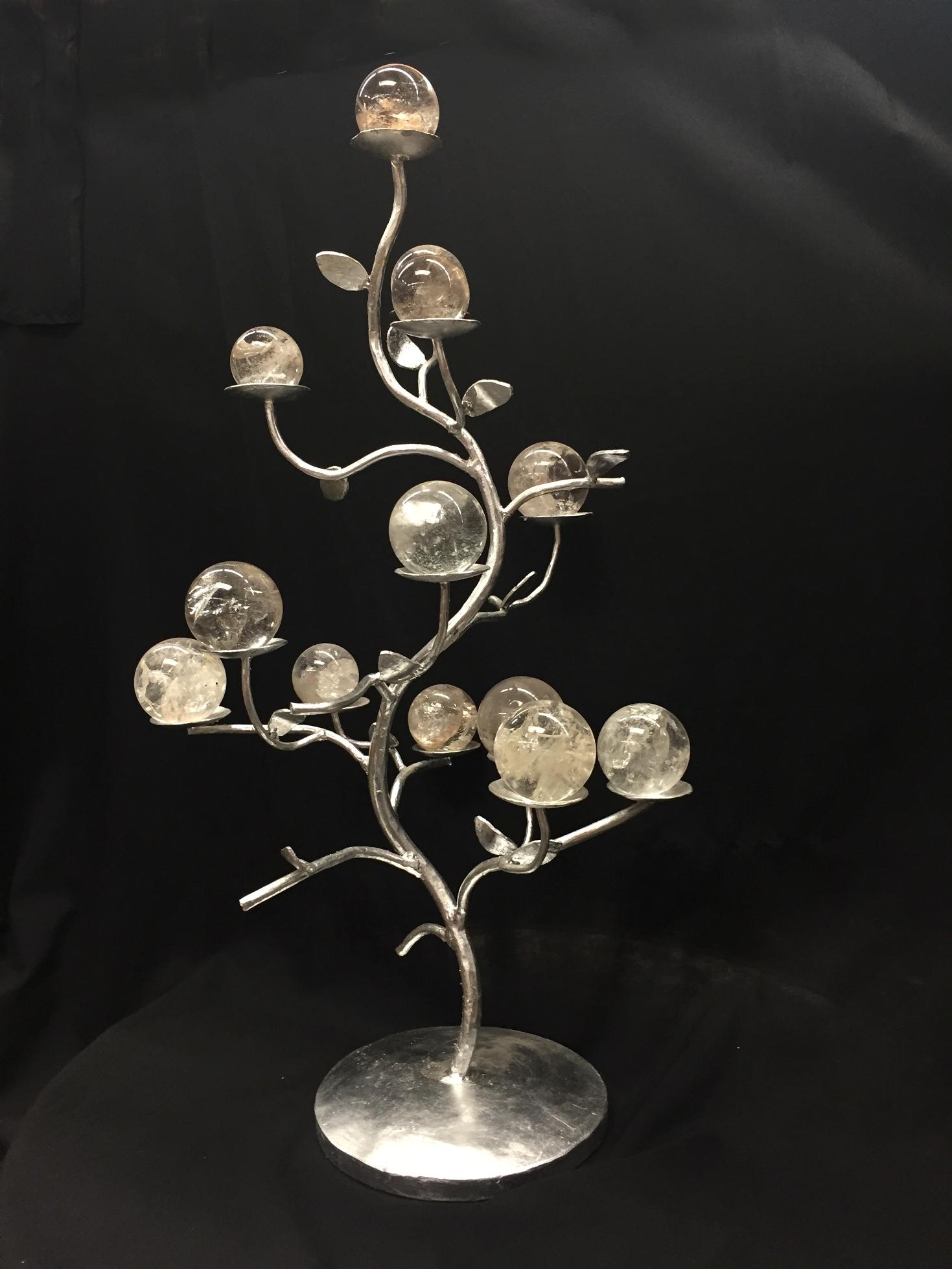 A unique modern style hand-forged wrought iron tree form centerpiece with 12 hand-polished rock crystal spheres in various sizes.
Each rock crystal sphere are resting on individual small saucers throughout the centerpiece.
The finish is imitation