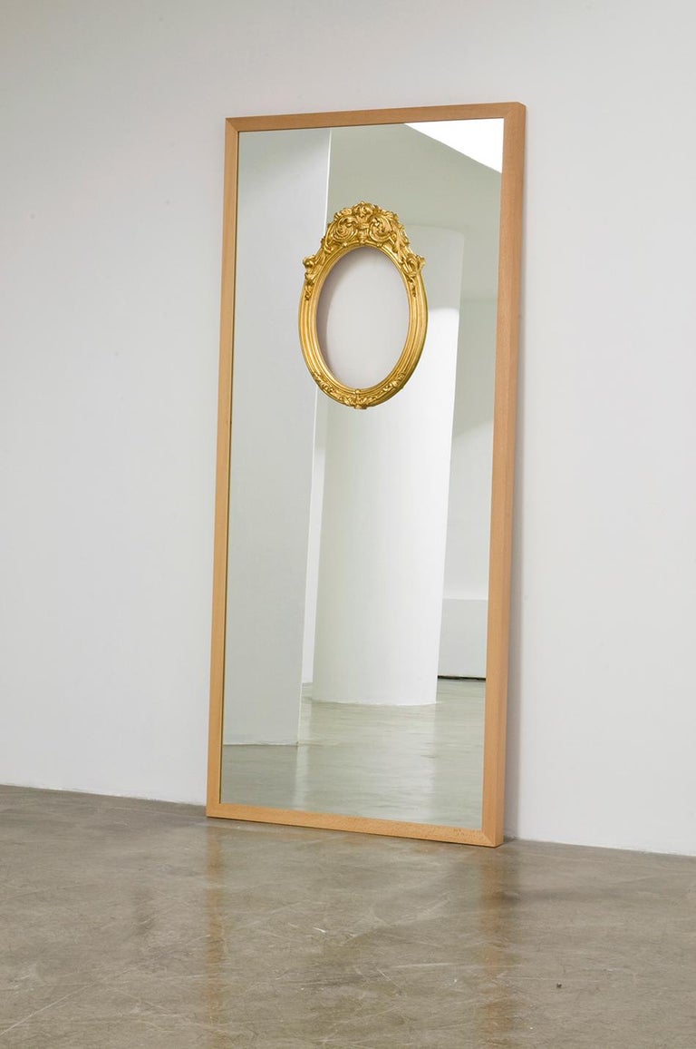 Mirror IV of the limited collection: IX mirrors. Rectangular framed mirror for Dilmos Milano in which narratives have been introduced. The reflection of the spectator is no longer objective, containing more than a reflection and the functional