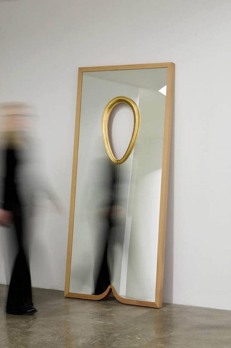 Mirror V of the limited collection: IX mirrors. Rectangular framed mirror for Dilmos Milano in which narratives have been introduced. The reflection of the spectator is no longer objective, containing more than a reflection and the functional aspect