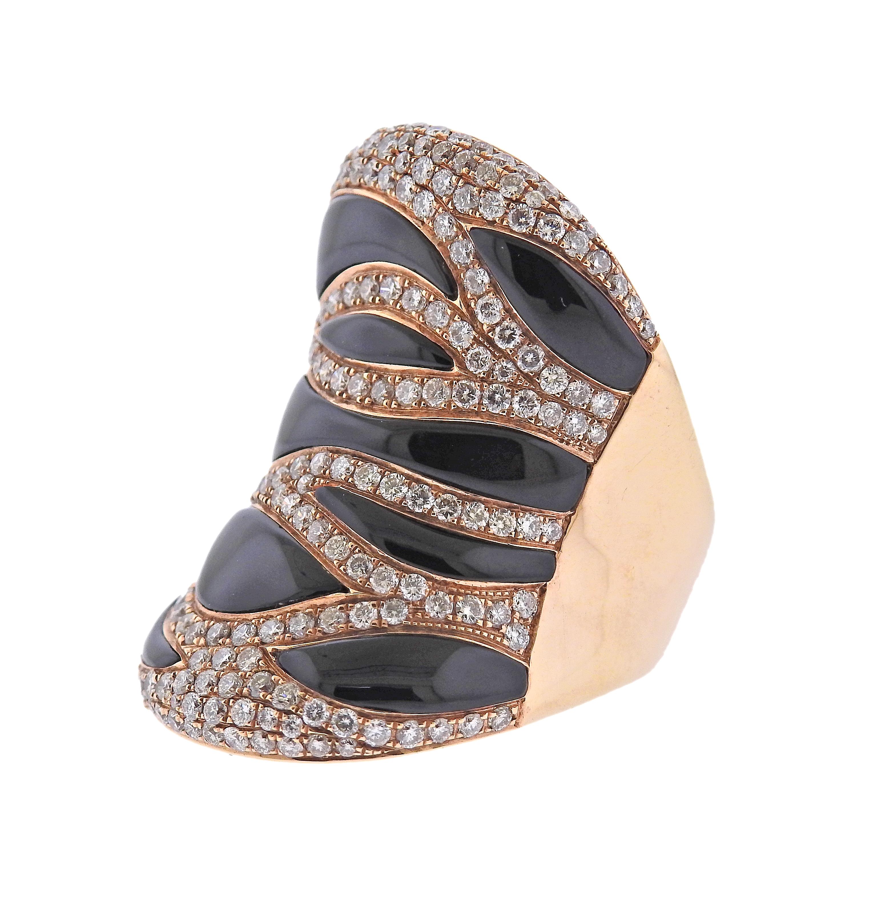 Modern 18k rose gold wide ring, featuring zebra stripes design, set with black onyx and approx. 1.60ctw in H/VS diamonds. Ring size 7, ring top is 35mm wide. Marked 750. Weight - 22.4 grams.