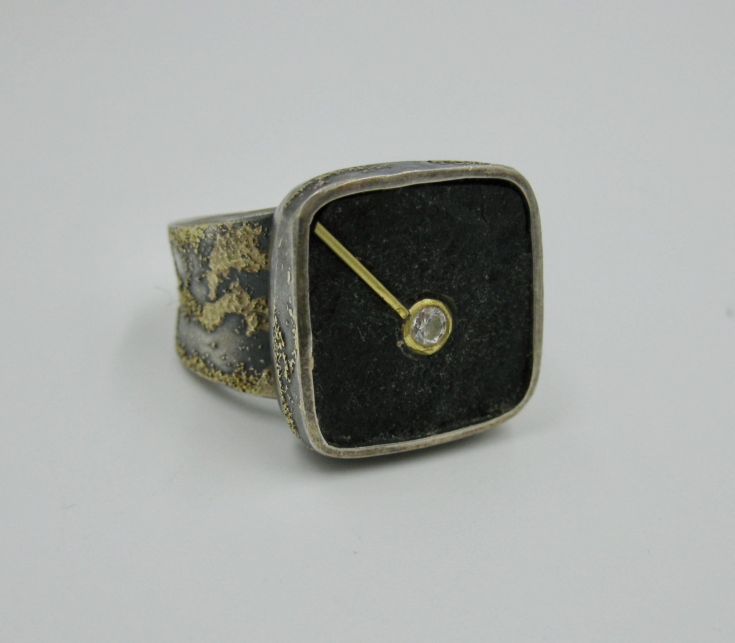 THIS IS A WONDERFUL MID-CENTURY MODERNIST EAMES ERA RING BY THE HIGHLY COLLECTIBLE MASTER JEWELER ROSS COPPELMAN.   The ring in Sterling Silver centering a square Hardstone with 22 Karat Gold accents and a Diamond center in a modern watch motif