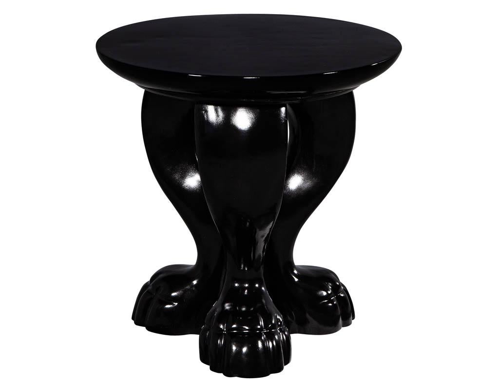Modern round black lacquered claw side table. Featuring high gloss black finish and unique styling.
Price includes complimentary curb side delivery to the continental USA.