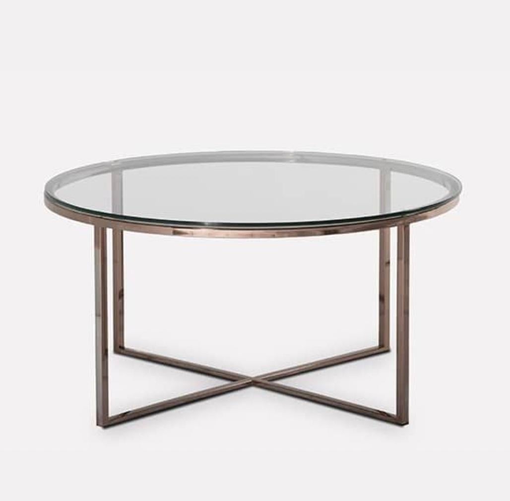 Hope is a coffee table with a round-shaped top and a crossed straight base in polished copper.? The glass top is available in different shapes, it gives lightness and versatility to this coffee table.

As shown glass: Clear glass metal: Inox