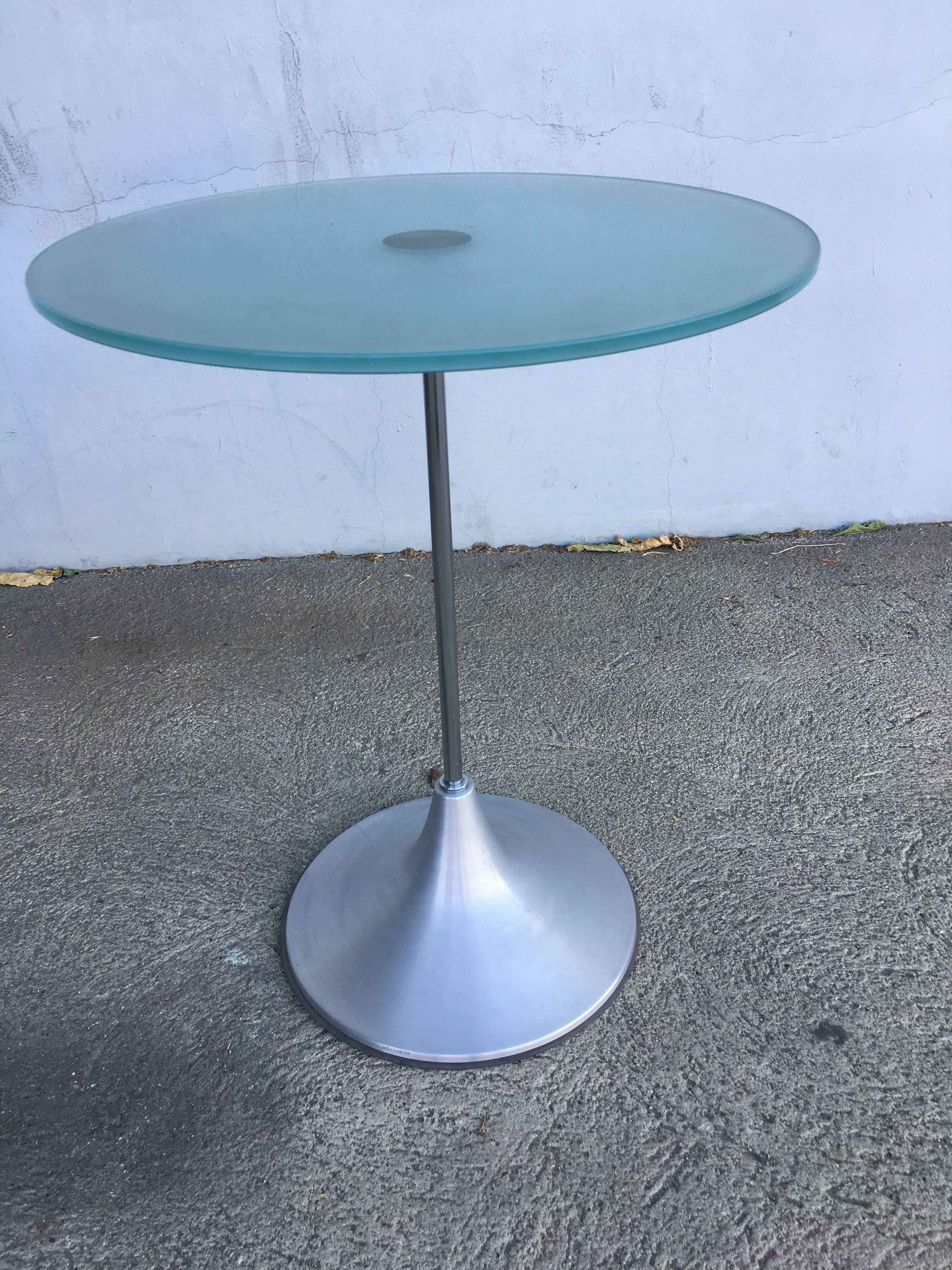 Modern round glass side table featuring a spun aluminum cone base with a coated chrome colored steel stem connected to the center of a round frosted glass top. Available-6, circa 2000.