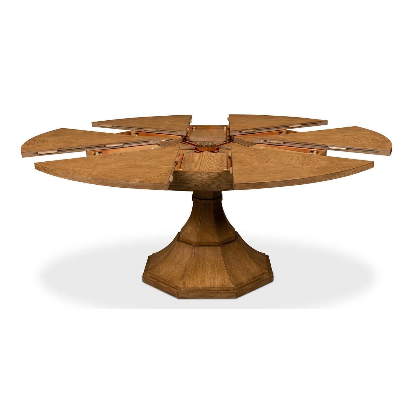 Modern round dining table modern round oak and oak veneered extension dining table with self-storing leaves, on a tapered column form pedestal base.

Open dimensions: 70